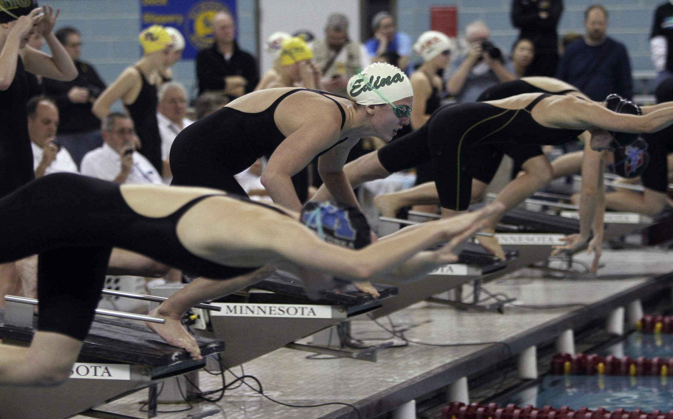 Olivia Anderson, of Edina, prepared to leap off the block at the beginning of the 200 yard freestyle relay during the finals of the girls' swimming and diving championship at the University of Minnesota Aquatic Center in Minneapolis Saturday, November 19, 2011. Edina won the relay.