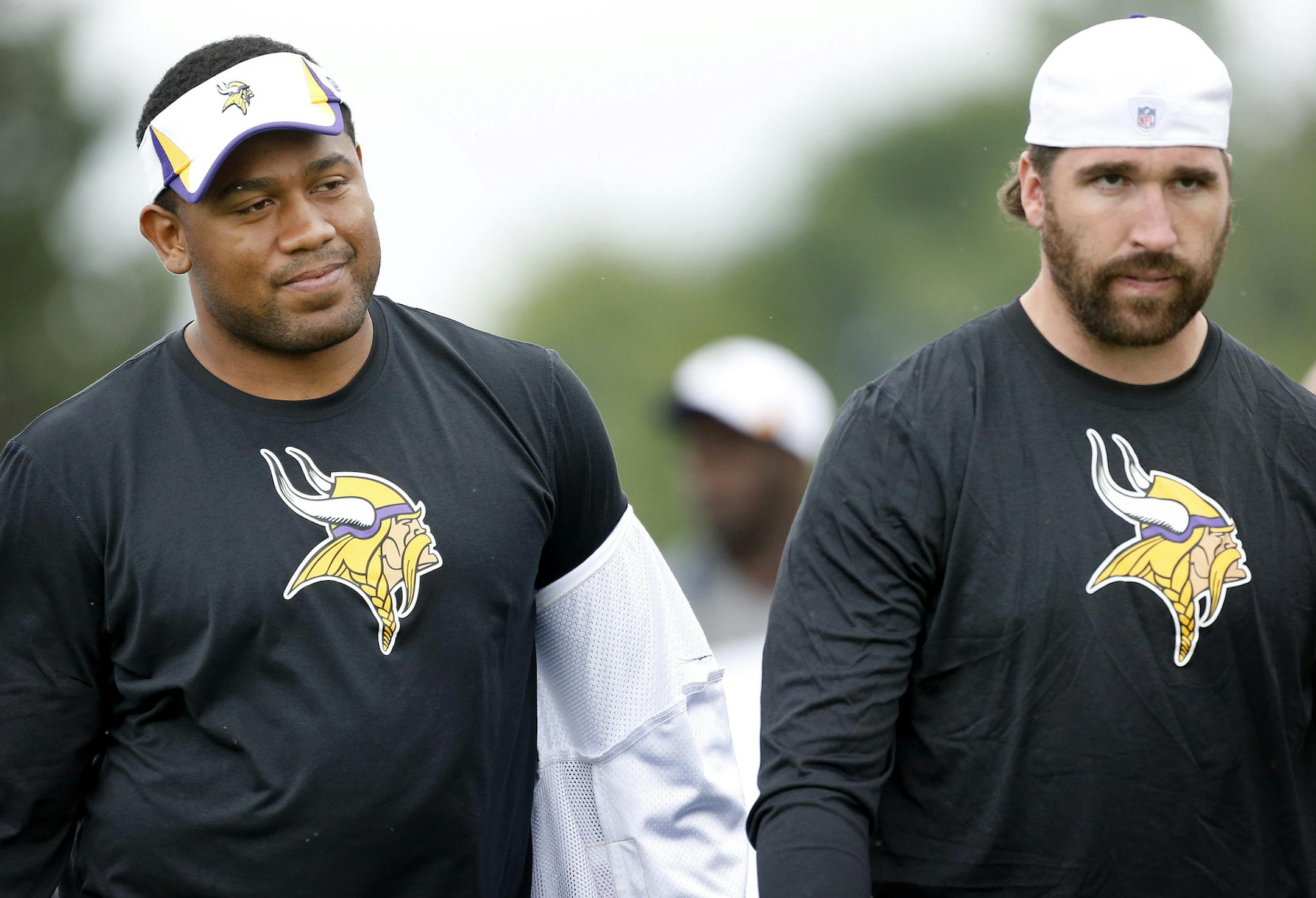 Minnesota Vikings defensive lineman Kevin Williams and Jared Allen walked off the field after the morning practice on July 30, 2013, during training camp, Mankato.