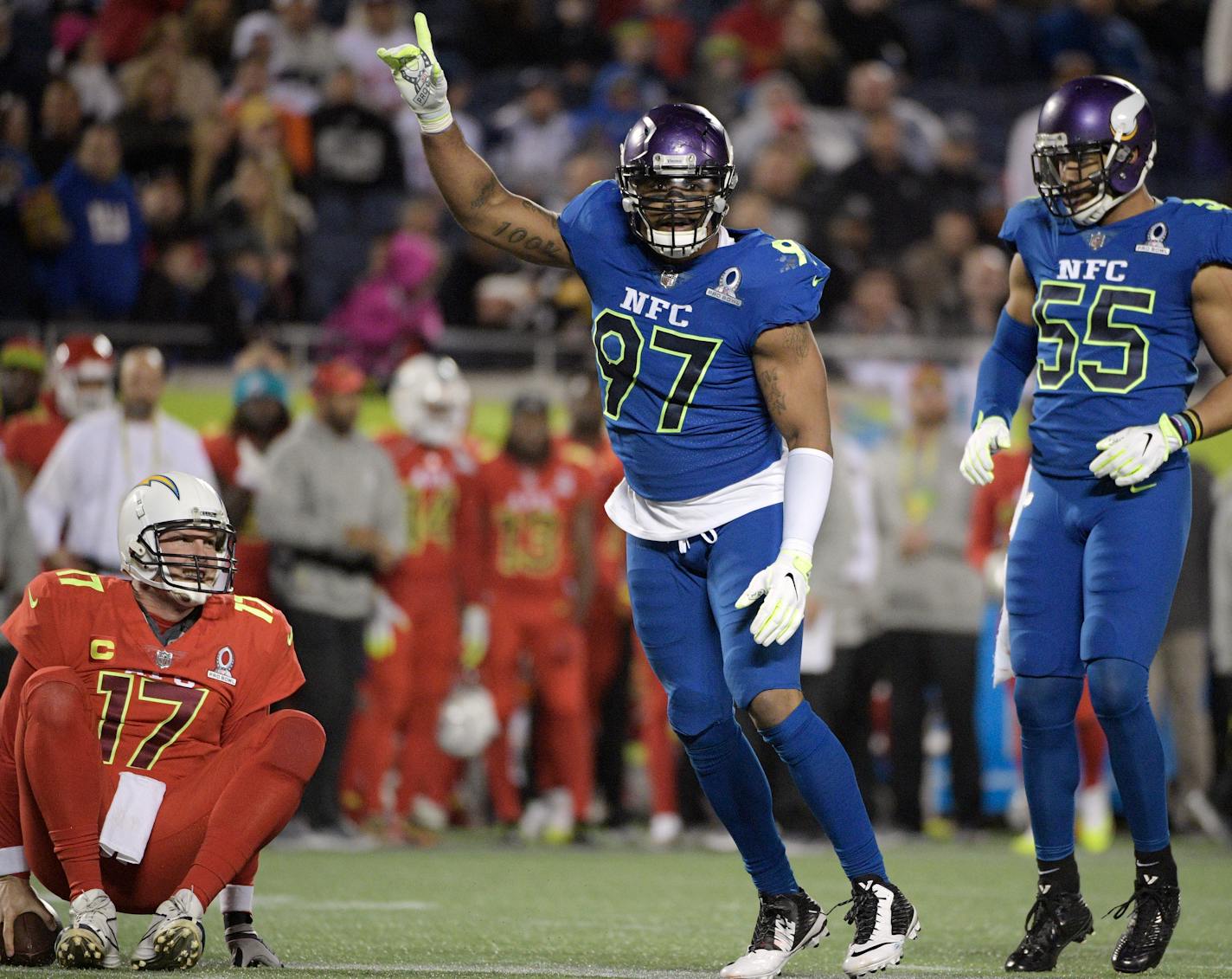 NFC defensive end Everson Griffen (97) of the Vikings celebrated after sacking AFC quarterback Philip Rivers of the Los Angeles Chargers during the second half of the Pro Bowl on Sunday in Orlando, Fla. To the right is NFC linebacker Anthony Barr of the Vikings.