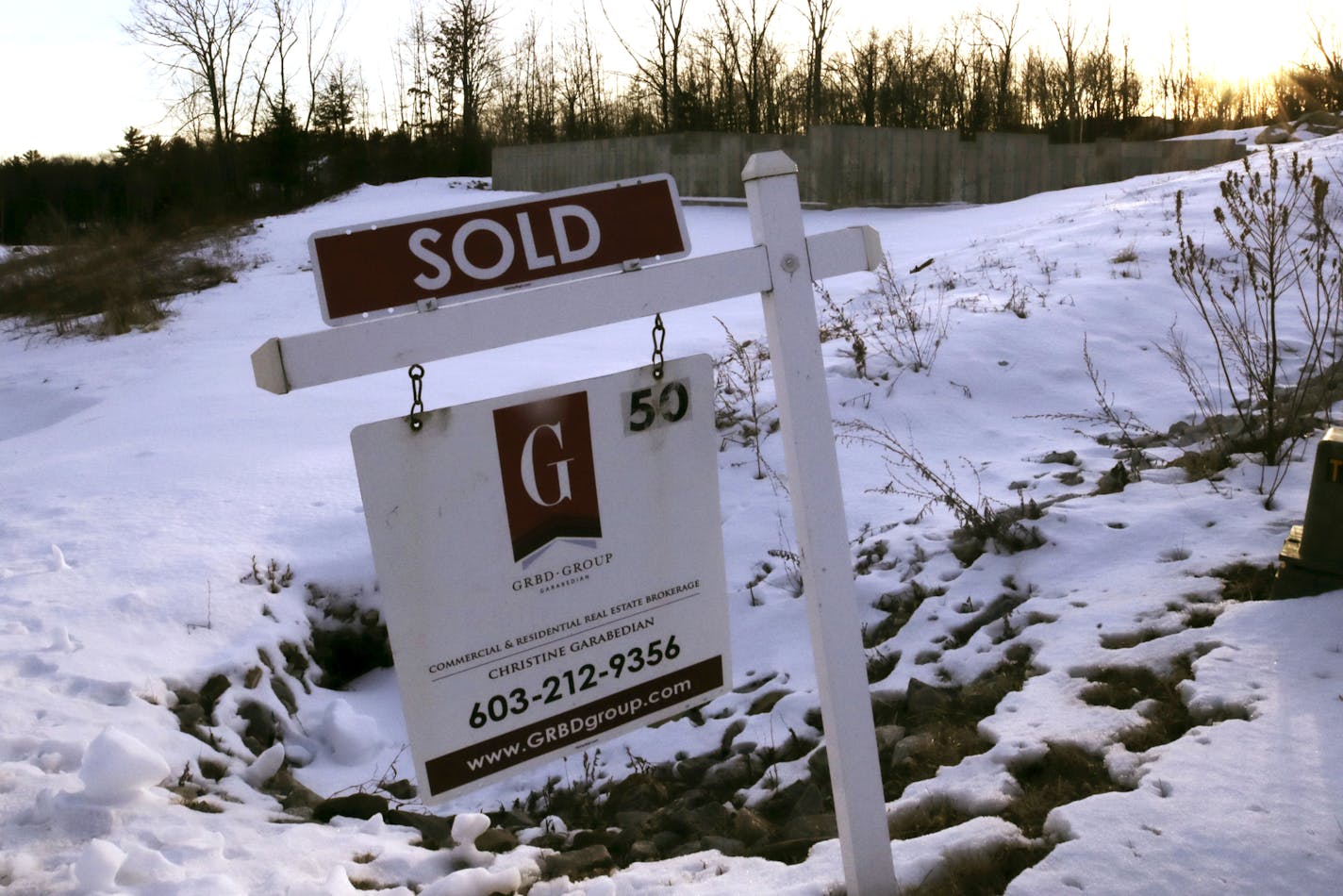 Mortgage brokers say they are as busy as they have ever been as mortgage interest rates dropped to the lowest level on record this week. (AP Photo/Charles Krupa)