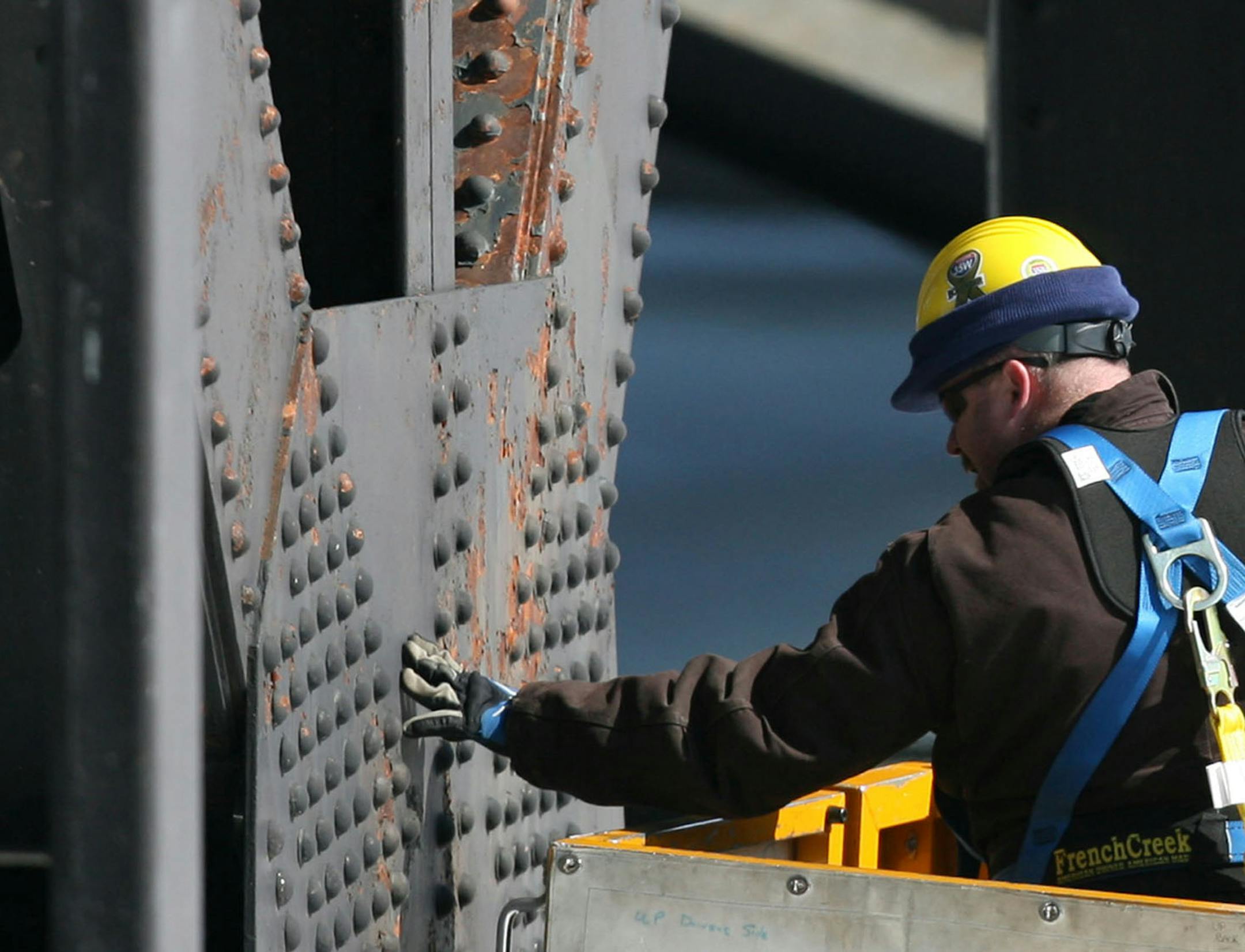 A bridge inspector looked over a gusset plate on the Hwy. 23 Bridge in downtown St. Cloud in March. Officials announced Thursday that the bridge will be replaced.