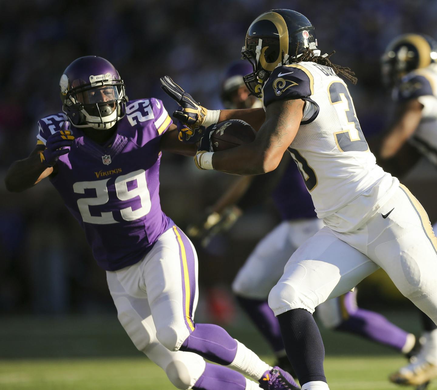 Rams running back Todd Gurley (30) prepared to stiff arm Vikings cornerback Xavier Rhodes (29) while gaining three yards in the fourth quarter Sunday afternoon. ] JEFF WHEELER &#xef; jeff.wheeler@startribune.com The Minnesota Vikings beat the St. Louis Rams 21-18 in overtime on a 40 yard Blair Walsh field goal Sunday afternoon, November 8, 2015 at TCF Bank Stadium in Minneapolis.