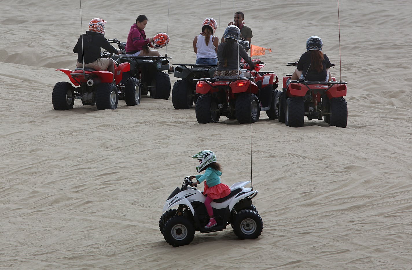 Four-year-old Nina Haley, 4, San Francisco, rode an ATV on her own, while her mother, Stacy Situ, watched from another ATV nearby at the Oceano Dunes State Vehicular Recreation Area in San Luis Obispo, California. ] JIM GEHRZ &#x201a;&#xc4;&#xa2; jgehrz@startribune.com / San Luis Obispo, CA 8/31, 2014 /1:00 PM / BACKGROUND INFORMATION: Trip to San Luis Obispo, CA, to cover ATV scene at Oceano Dunes State Vehicular Recreation Area along the Pacific Ocean. Also interviewed Dr. Larry Foreman, an ER