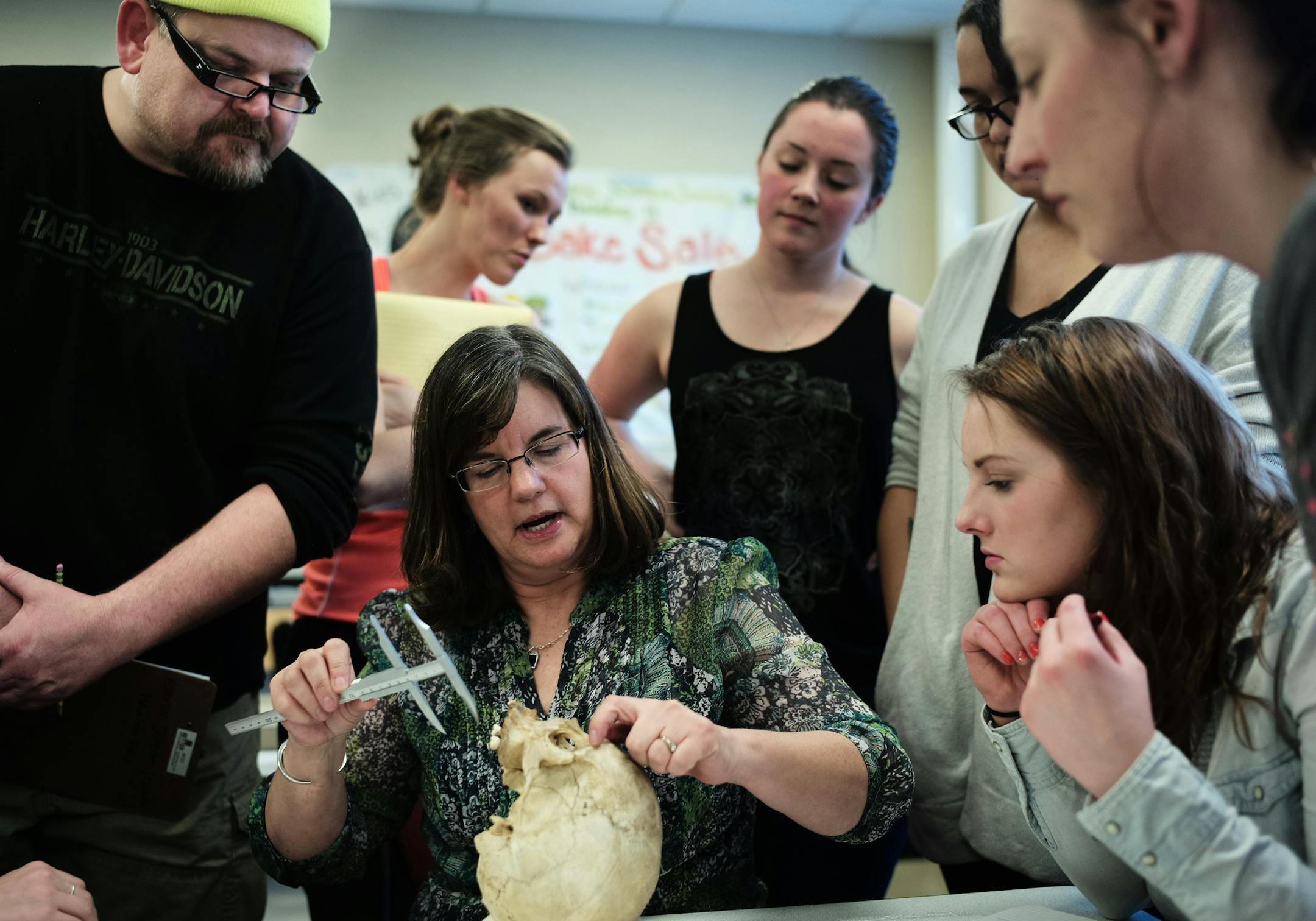 In a forensic anthropology class at Hamline University, professor Susan Myster takes 37 measurements on a skull whose origin is not well known. The data will be fed into a computer program called ForDisk" that can estimate sex, ancestry, and stature from a skeleton of unknown origin."] Richard Tsong-Taatarii/rtsong-taatarii@startribune.com