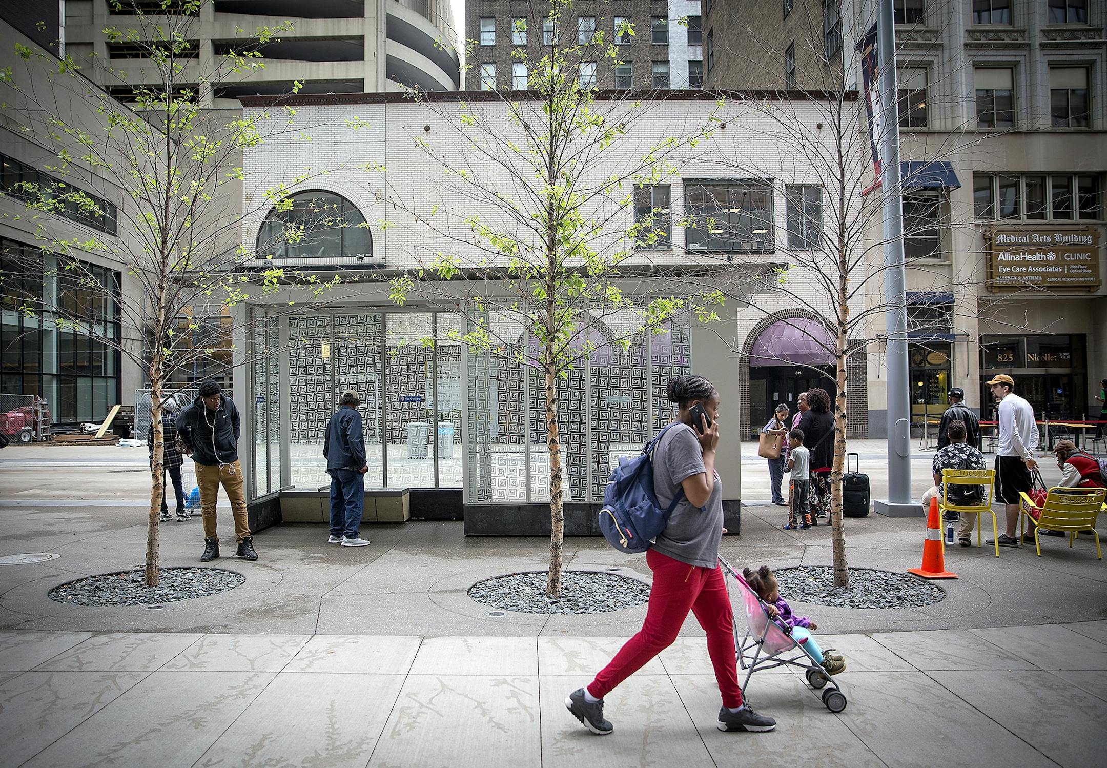 Pedestrians made their way along Nicollet Mall where the trees on the newly redesigned area are dying en masse, Wednesday, June 6, 2018 in Minneapolis, MN. The city may have to replant them because they're dying so quickly.