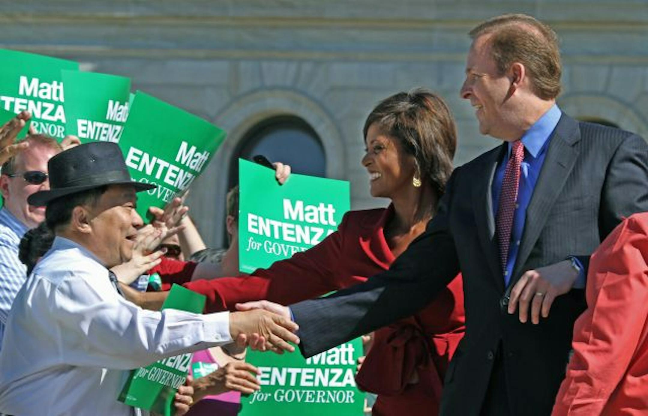 (left to right) Candidates Robyne Robinson and Matt Entenza shook hands with supporters just before a press conference where Entenza announced Robinson as his running mate.