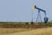 A field oil pumper is seen in a farm field Friday, July 13, 2012 near Edinburg, Ill. (AP Photo/Seth Perlman) ORG XMIT: ILSP101