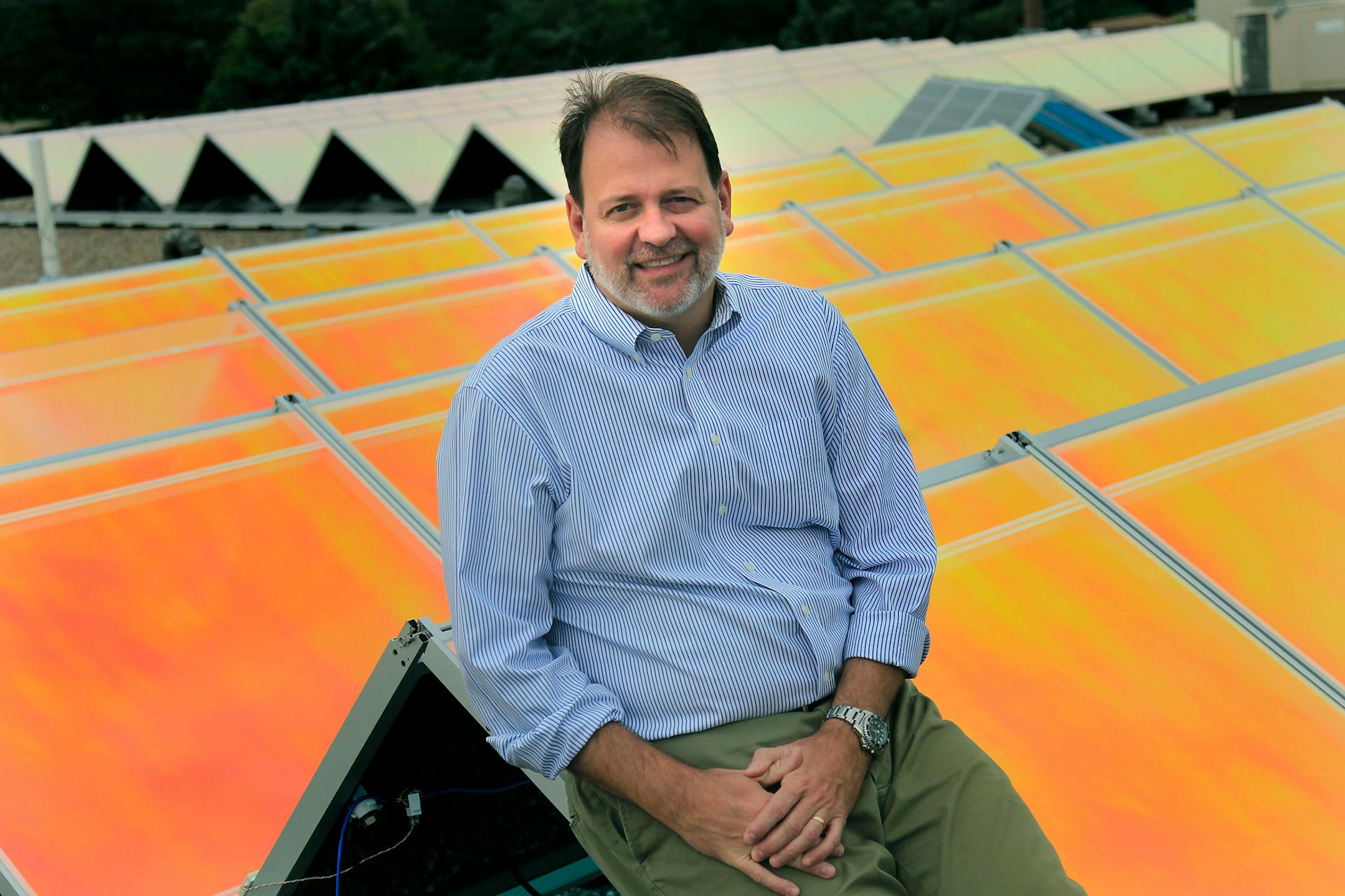 Joel Cannon, the CEO of tenKSolar, a manufacturer of solar panels, was photographed on tenKSolar's roof, Tuesday, August 2, 2012 in Bloomington, MN. (ELIZABETH FLORES/STAR TRIBUNE) ELIZABETH FLORES � eflores@startribune.com