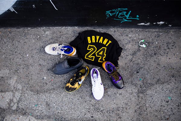 Items were left by at a mural of Kobe Bryant, the retired Los Angeles Lakers star, in downtown Los Angeles on Sunday.