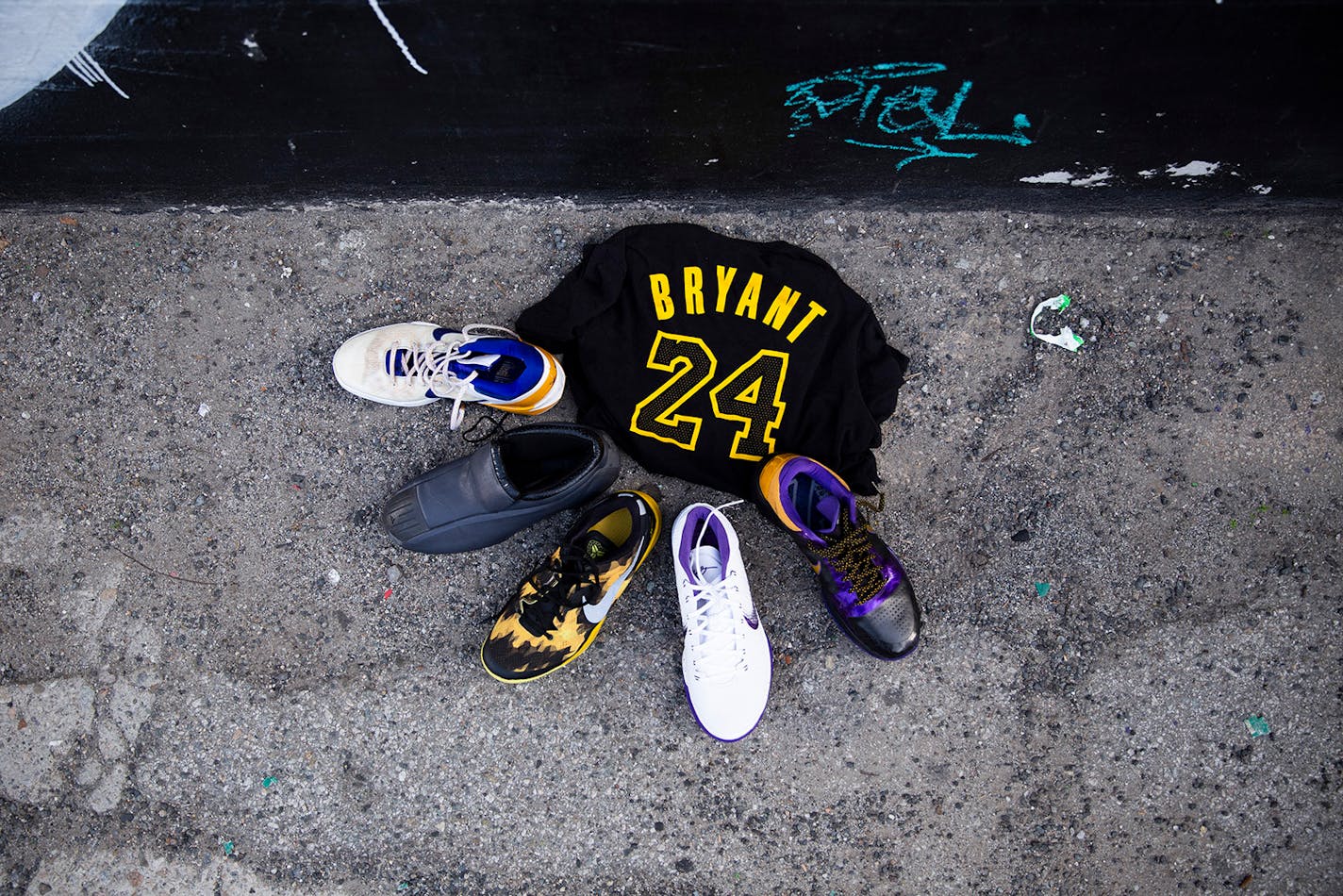 Items were left by at a mural of Kobe Bryant, the retired Los Angeles Lakers star, in downtown Los Angeles on Sunday.