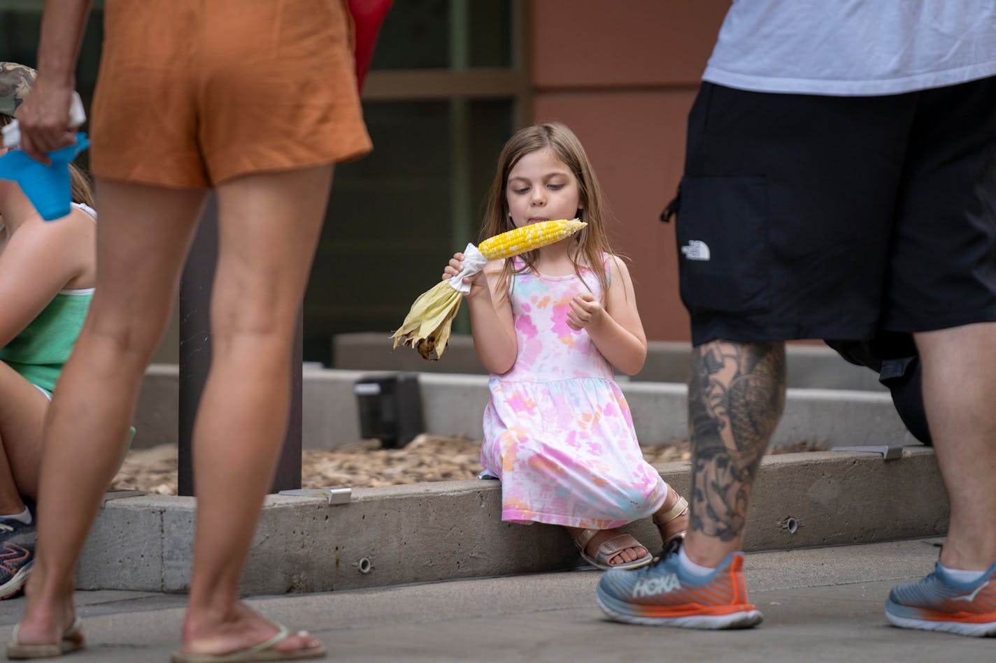 Estelle Alexander enjoys some sweet corn while at the Taste of Minnesota Sunday.