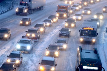 Traffic crawled into downtown near 26th and I 35 W Northbound in Minneapolis, MN, Tuesday, January 14, 2014. (ELIZABETH FLORES/STAR TRIBUNE) ELIZABETH