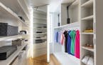 Boxes and baskets help keep this large closet modern and organized. (Design Recipes/TNS)