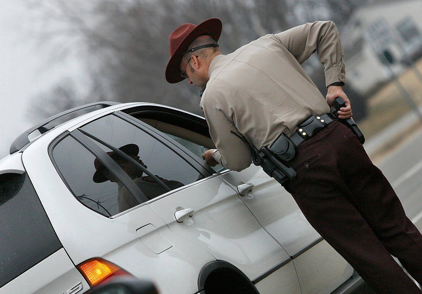 A member of the Minnesota State Patrol spoke with a driver after pulling him over in Inver Grove Heights.