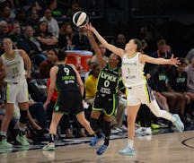 Lynx rookie Olivia Époupa (0) stole an inbounds pass intended for Wings guard Sevgi Uzun (1) in the fourth quarter. 