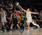 Lynx rookie guard Olivia Époupa (0) steals an inbounds pass intended for Wings guard Sevgi Uzun in the fourth quarter, which the Lynx began with a 16