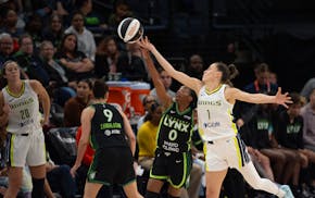 Lynx rookie guard Olivia Époupa (0) steals an inbounds pass intended for Wings guard Sevgi Uzun in the fourth quarter, which the Lynx began with a 16