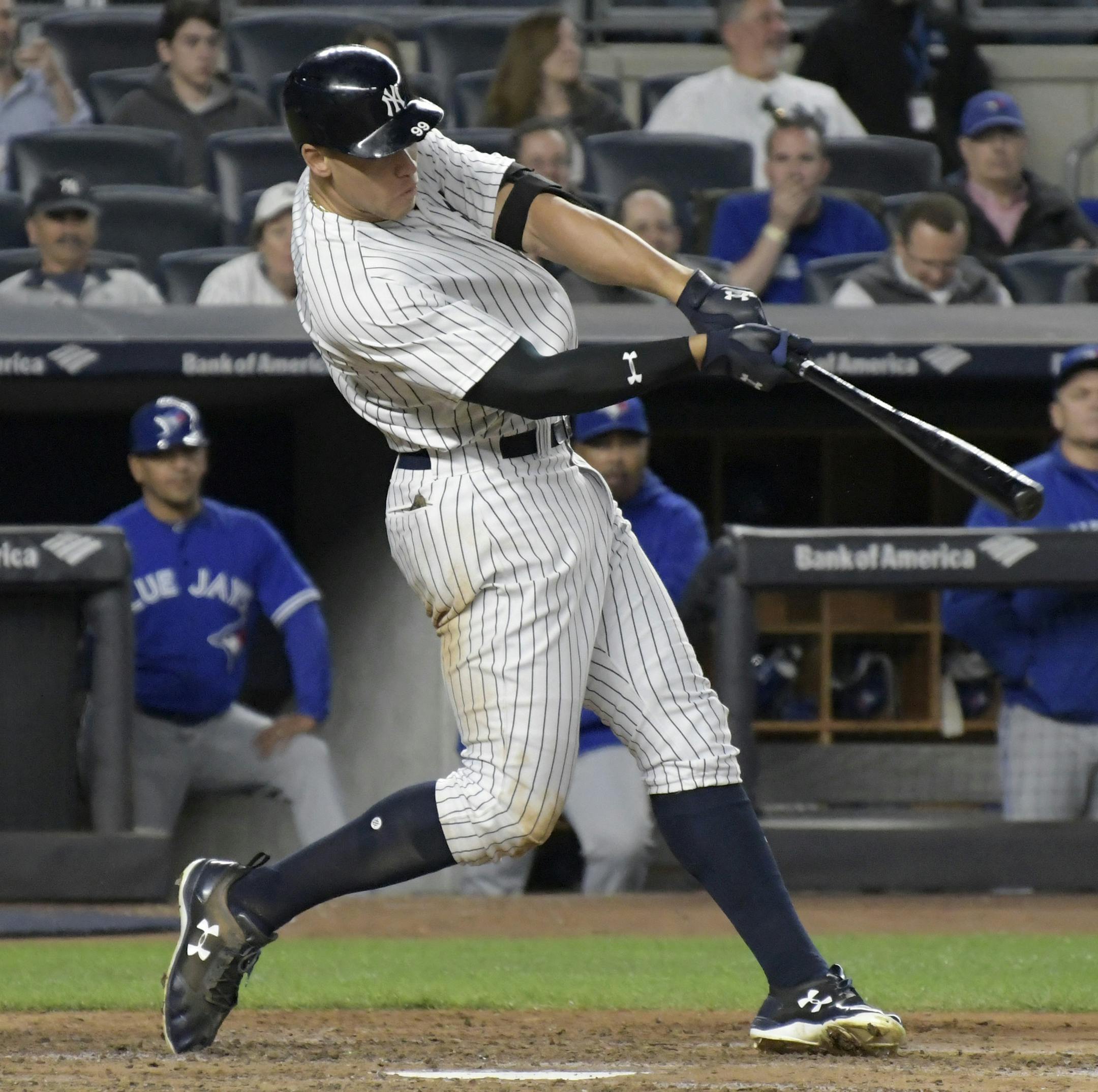 New York Yankees' Aaron Judge hits a two-run home run during the third inning of the team's baseball game against the Toronto Blue Jays on Wednesday, May 3, 2017, at Yankee Stadium in New York. (AP Photo/Bill Kostroun)