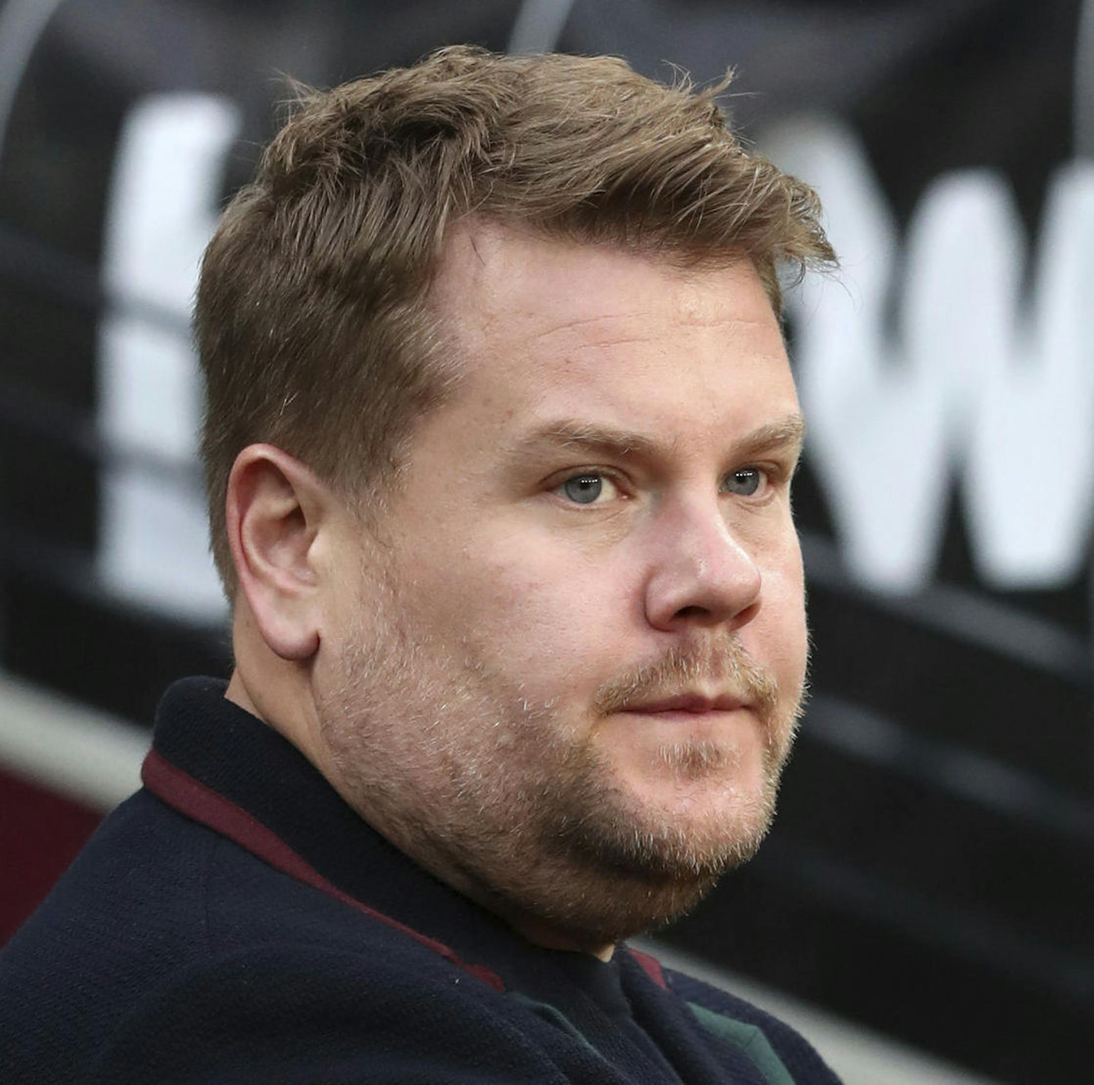 James Corden pitchside during the English Premier League soccer match between West Ham United and Watford at London Stadium in London, Saturday, Dec. 22, 2018. (Chris Radburn via AP)