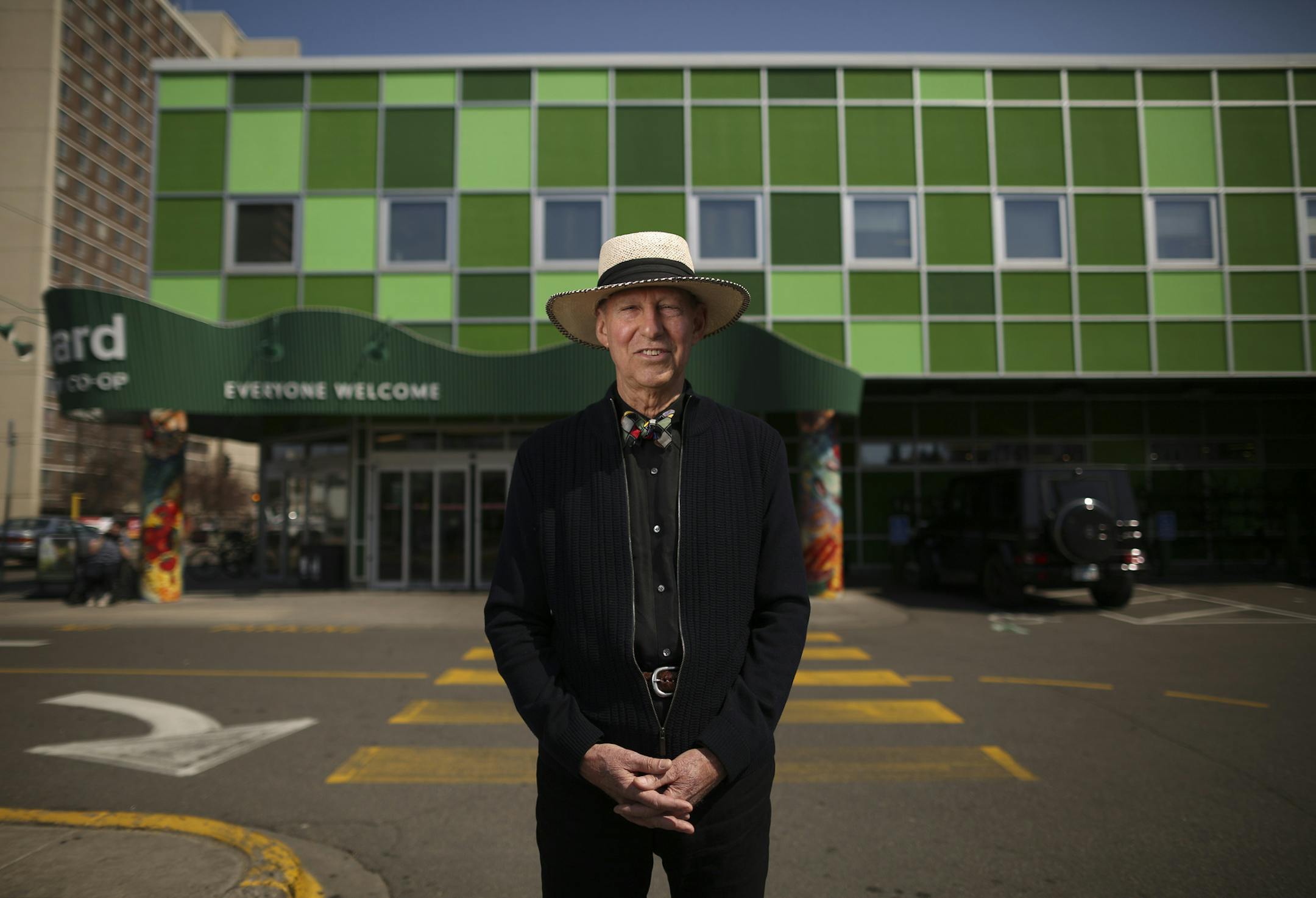 Architect Gar Hargens stands in front of one of his highest profile projects on East Franklin Av., the Seward Community Co-op.