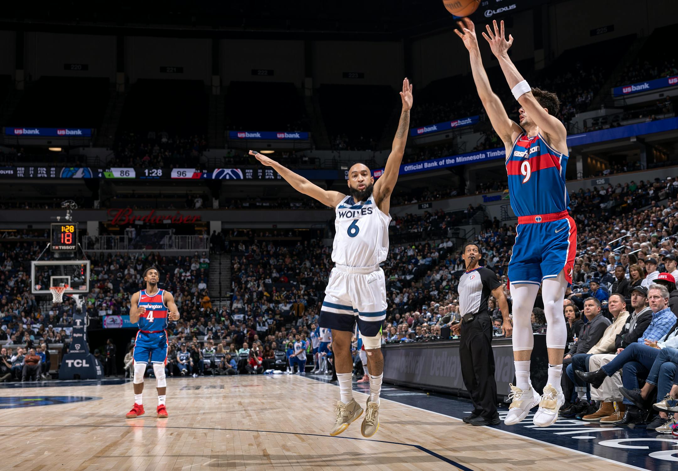 Deni Avdija (9) of Washington Wizards attempts a shot while defended by Jordan Mclaughlin (6) of the Minnesota Timberwolves in the third quarter.