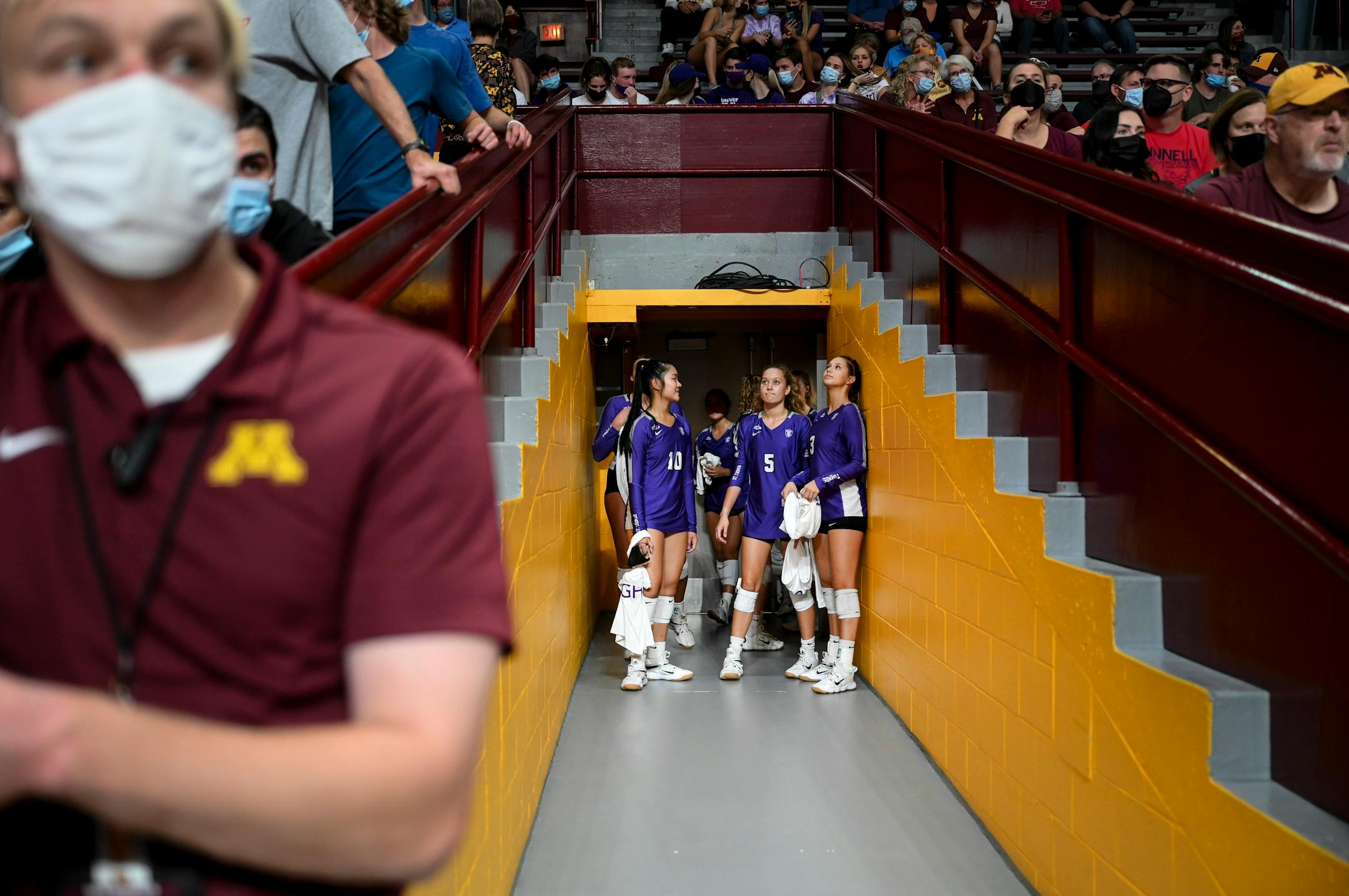 The St. Thomas Tommies prepared to tak the court before Thursday night's volleyball match against the University of Minnesota Gophers.