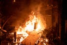 Thousands descended on the Third Precinct after Minneapolis Police abandoned the building, looting equipment and setting it ablaze.