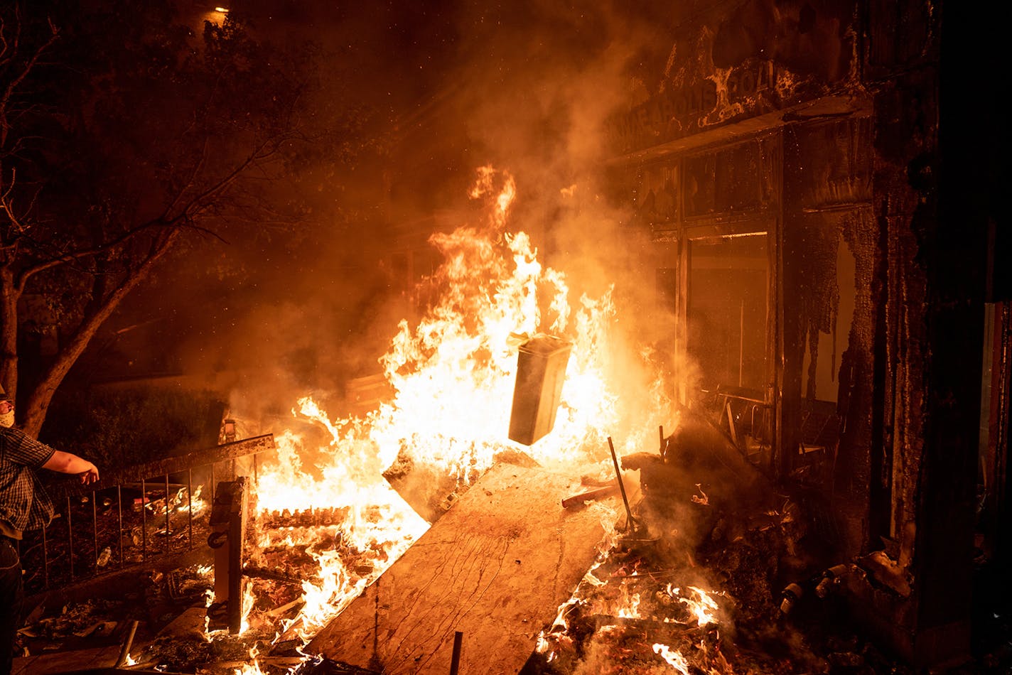 Thousands descended on the Third Precinct after Minneapolis Police abandoned the building, looting equipment and setting it ablaze.