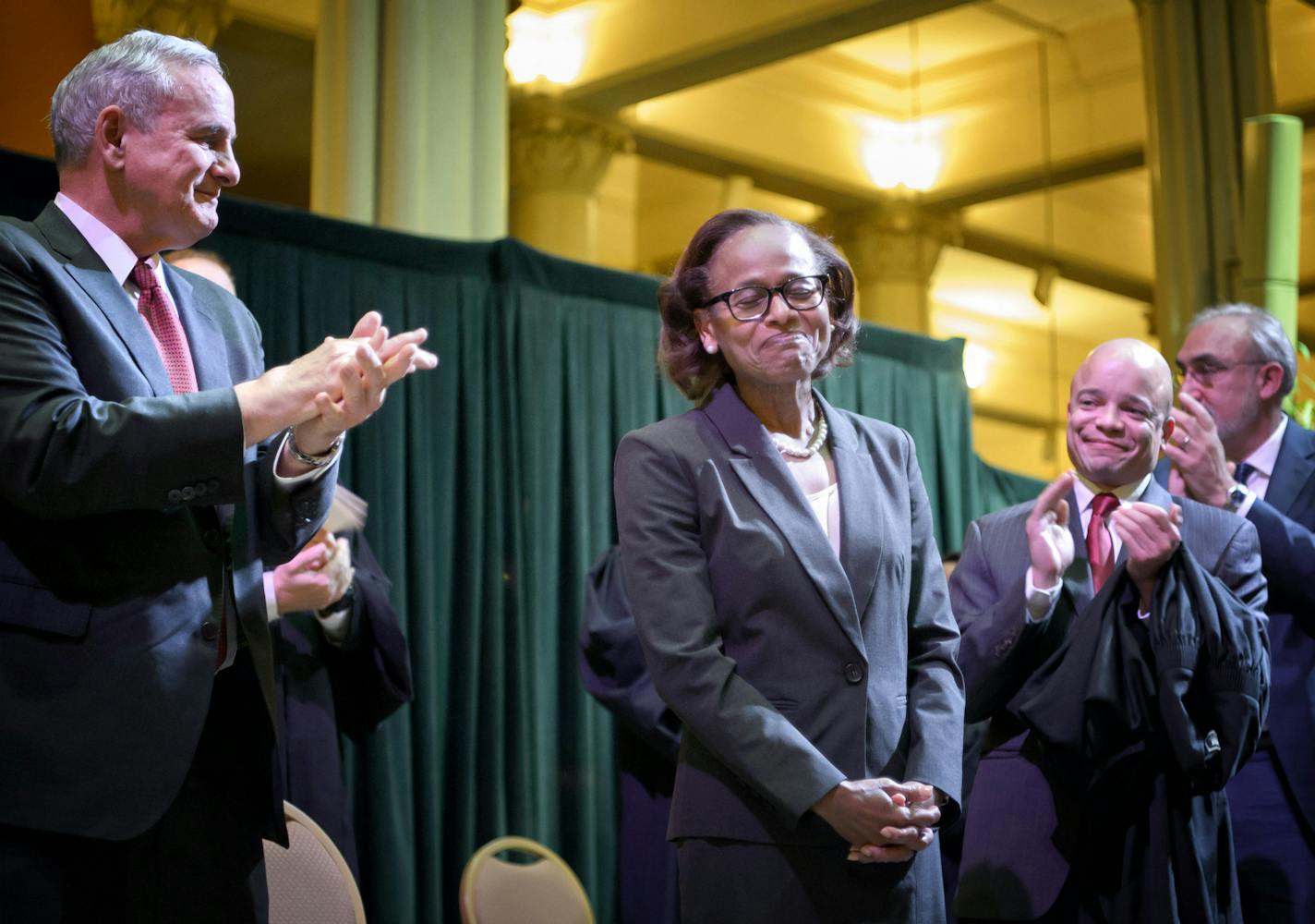 Judge Natalie Hudson received a standing ovation after she was sworn in. On the left, Governor Mark Dayton, on the right Hudson's son Kobie Hudson. ] GLEN STUBBE * gstubbe@startribune.com Friday, November 20, 2015 Judge Natalie Hudson was sworn in Friday, becoming the second African-American woman on the Minnesota Supreme Court.