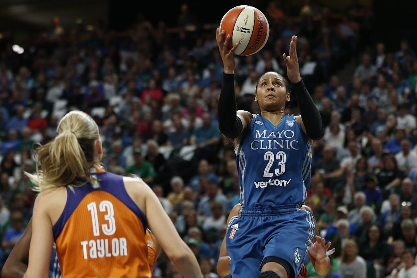 Minnesota Lynx forward Maya Moore (23) lines up a shot during the first half of Game 2 of the WNBA basketball semifinals against the Phoenix Mercury, Friday, Sept. 30, 2016, in St. Paul.