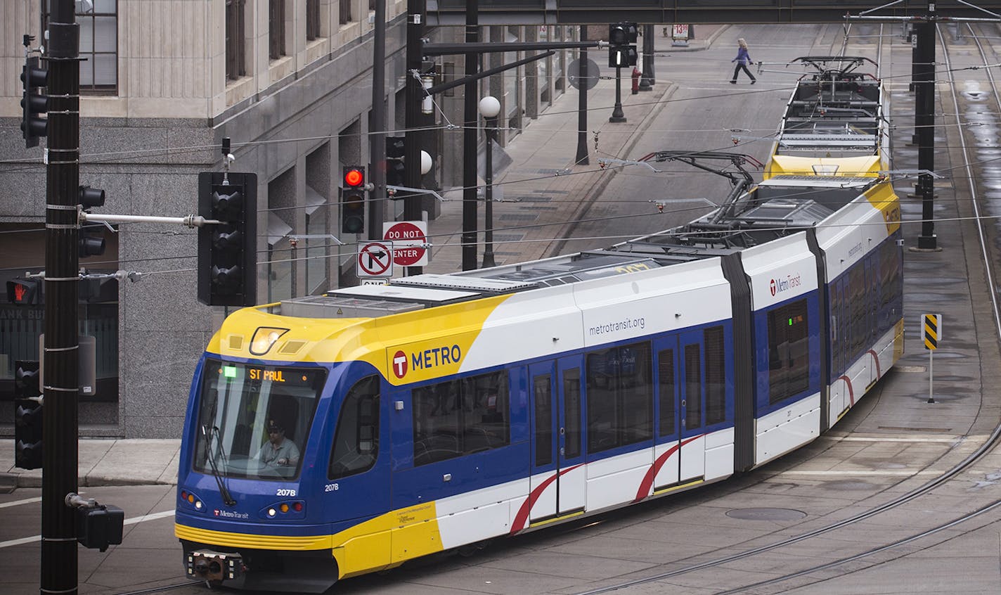 The Metro Green Line turns off 4th Street in downtown St. Paul. ] (Leila Navidi/Star Tribune) leila.navidi@startribune.com BACKGROUND INFORMATION: Monday, March 14, 2016 in downtown St. Paul. A group of building and business owners along the stretch of 4th Street in downtown St. Paul hope to change its status as a dead zone between bustling areas. On Monday they debuted a plan for what they call the 4th Street Market District. The members of the business community now hope city officials will bu