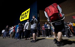 Shoppers stand in line for the late-night release of the Nintendo Switch 2 at Best Buy in Roseville, Minn., on Wednesday, June 4, 2025.