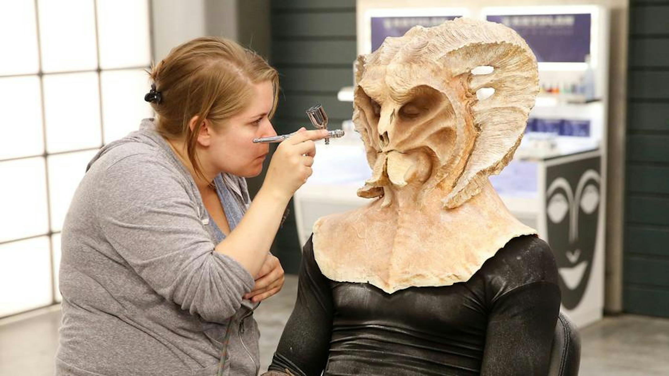 Darla Edin of St. Louis Park finishes up a makeup application on the SyFy show "Face Off."