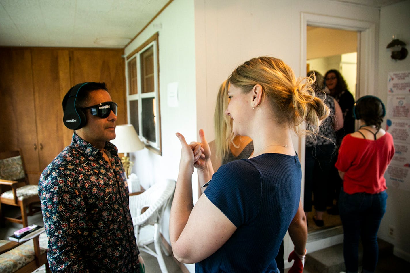 Jorge Marquez is fitted with a pair of DementiaLive glasses at the University of Northern Iowa Dementia Simulation House, Tuesday, May 10, 2022, in Cedar Falls, Iowa. (Joseph Cress/Iowa City Press-Citizen via AP)