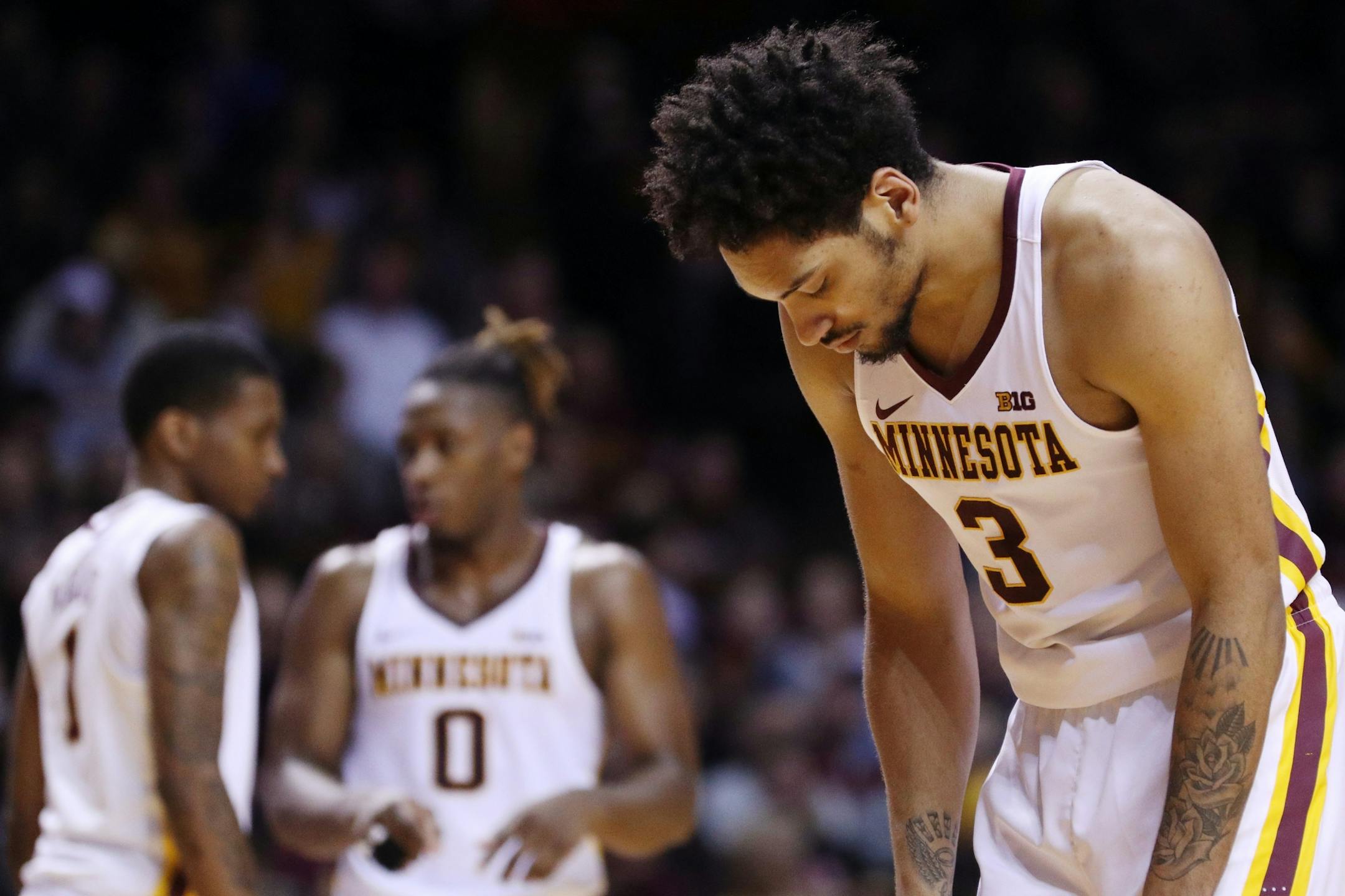 Minnesota Golden Gophers forward Jordan Murphy (3) hug his head for a moment after the Minnesota Golden Gophers were unable to score during the second half.