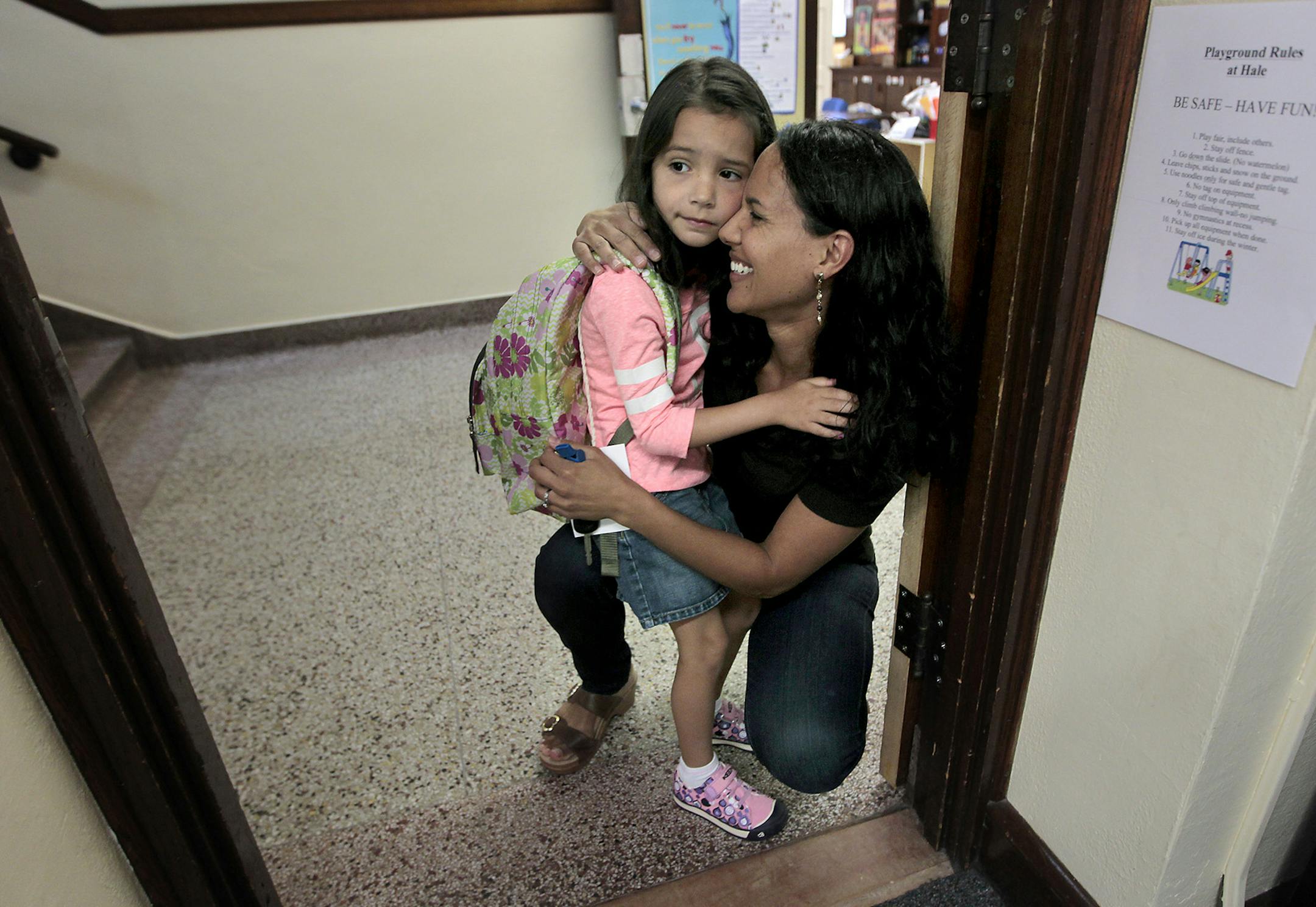 Tia Bastian gave her daughter Avery, 5, a hug before going into Dana Elfering's class for the first day of kindergarten, Wednesday, August 27, 2014 in Minneapolis, MN. ] (ELIZABETH FLORES/STAR TRIBUNE) ELIZABETH FLORES • eflores@startribune.com