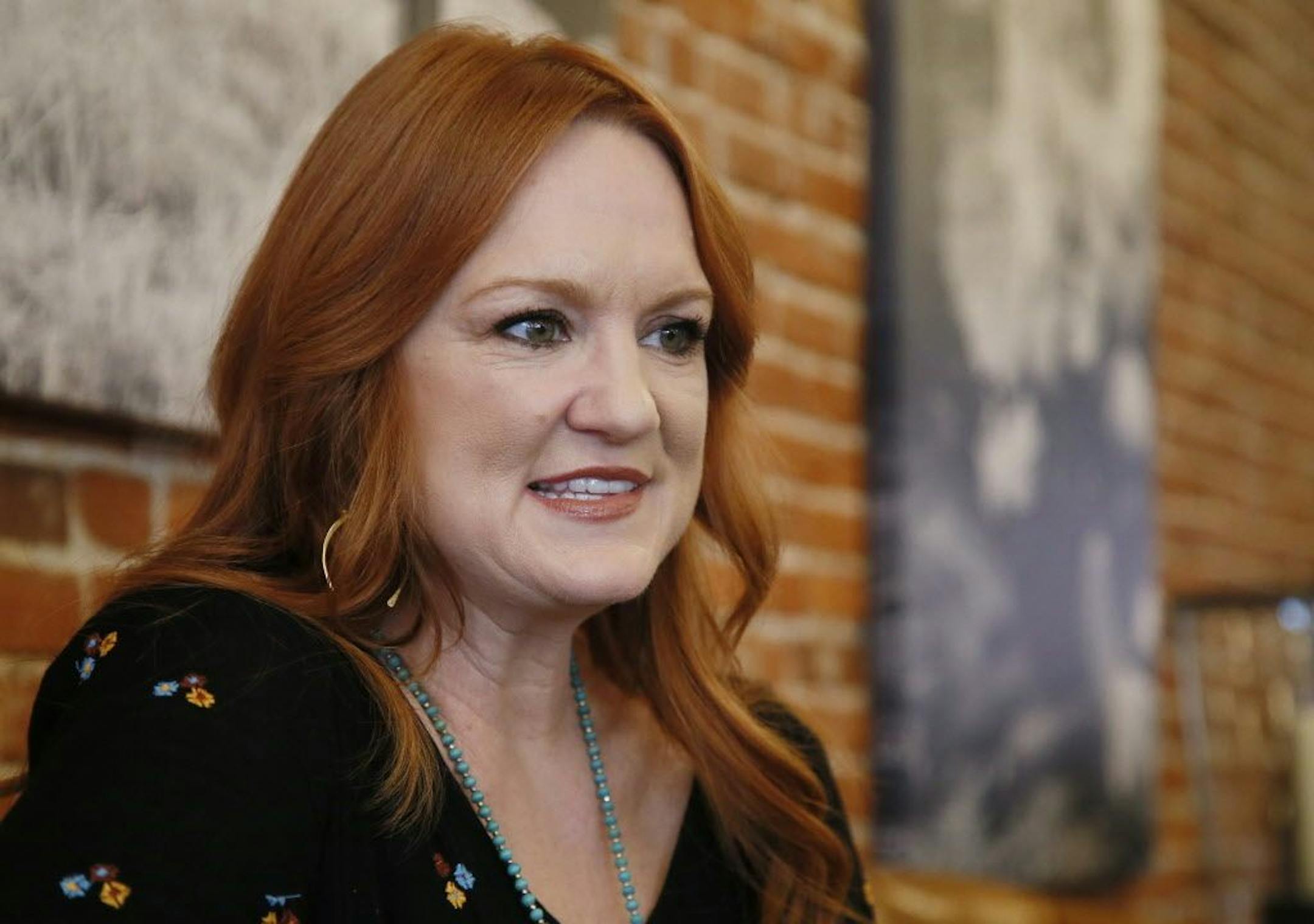 In this Wednesday, June 14, 2017, photo, Ree Drummond listens during an interview in Pawhuska, Okla. Growing up in a town she considered "too small," Drummond sought the bright lights of a city, and wound up in an even smaller town where she has built a virtual media empire on the Plains of northeast Oklahoma.