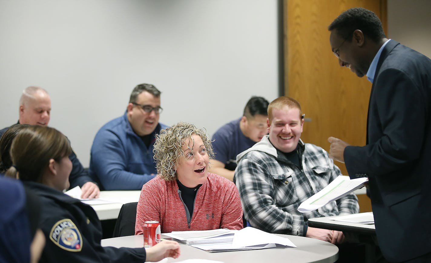 Ali Warsame, right, challenges Metro transit cops to pronouncing the Somali alphabet during a Somali language class, Wednesday, March 2, 2016 in st. Paul, MN. ] (ELIZABETH FLORES/STAR TRIBUNE) ELIZABETH FLORES &#x2022; eflores@startribune.com