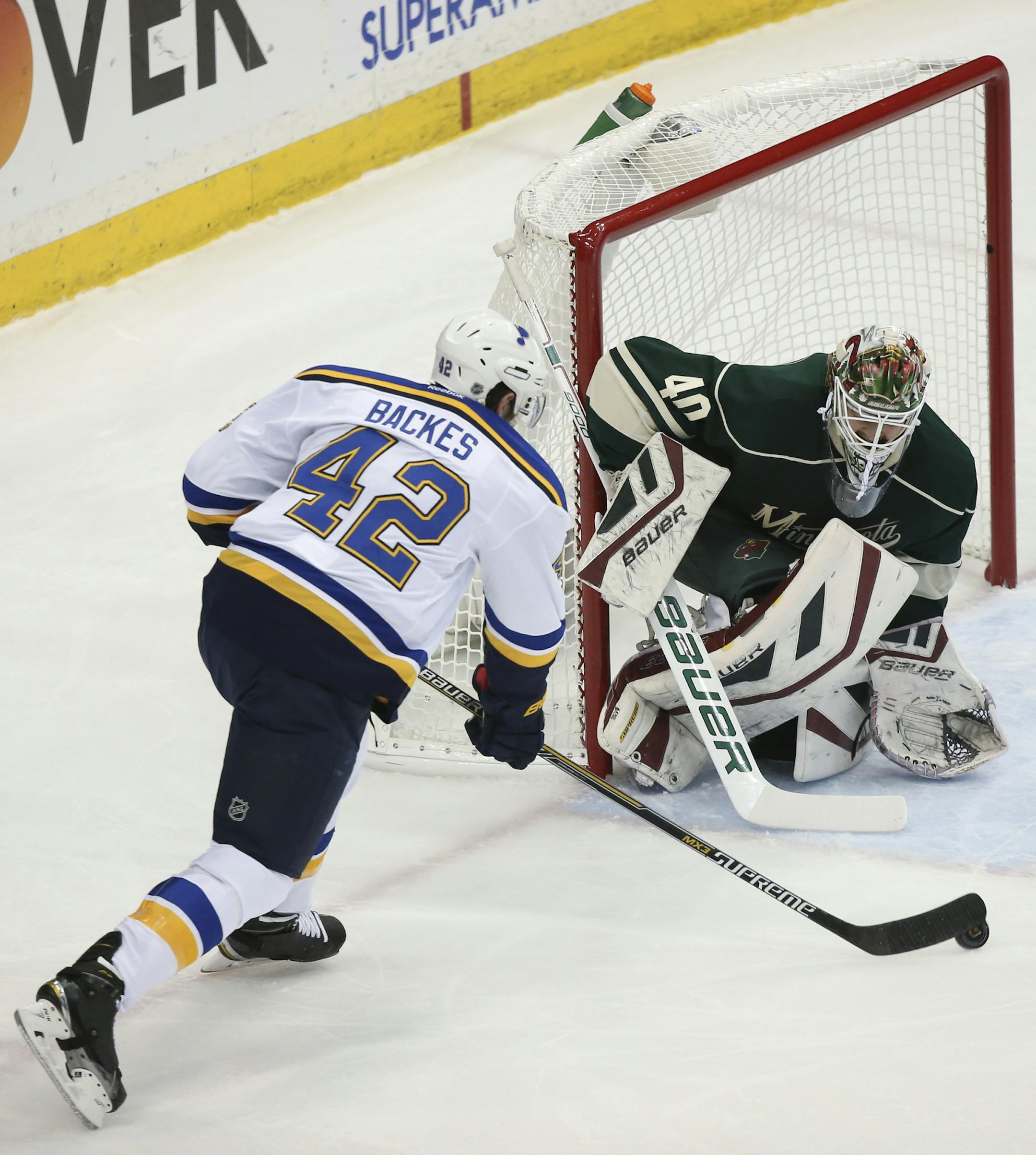 St. Louis Blues center David Backes (42) took a first period shot on Minnesota Wild goalie Devan Dubnyk (40) Wednesday night. ] JEFF WHEELER ï jeff.wheeler@startribune.com The Minnesota Wild met the St. Louis Blues in game 4 of their NHL playoff series Wednesday night, April 22, 2015 at Xcel Energy Center in St. Paul.