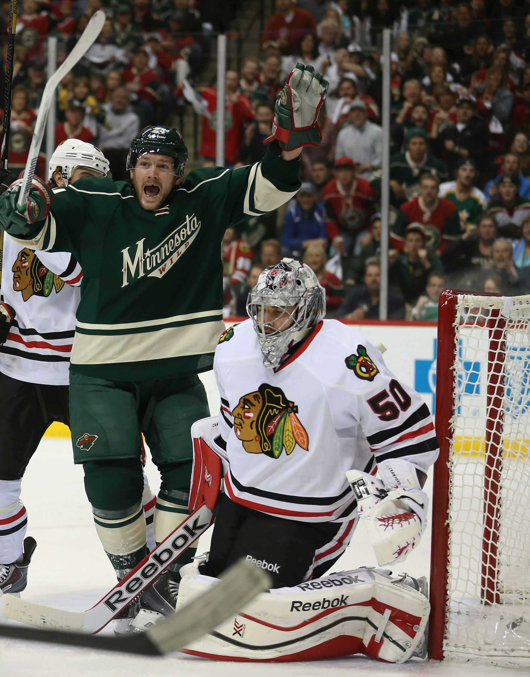 Minnesota Wild left wing Matt Cooke (24) celebrated after the Wild scored during first period action. ] (JEFF WHEELER/STAR TRIBUNE) jeff.wheeler@startribune.com The Wild vs the Chicago Blackhawks in game four of the of the Stanley Cup playoffs at the Xcel Energy Center in St. Paul, Min., Friday, May 9, 2014.