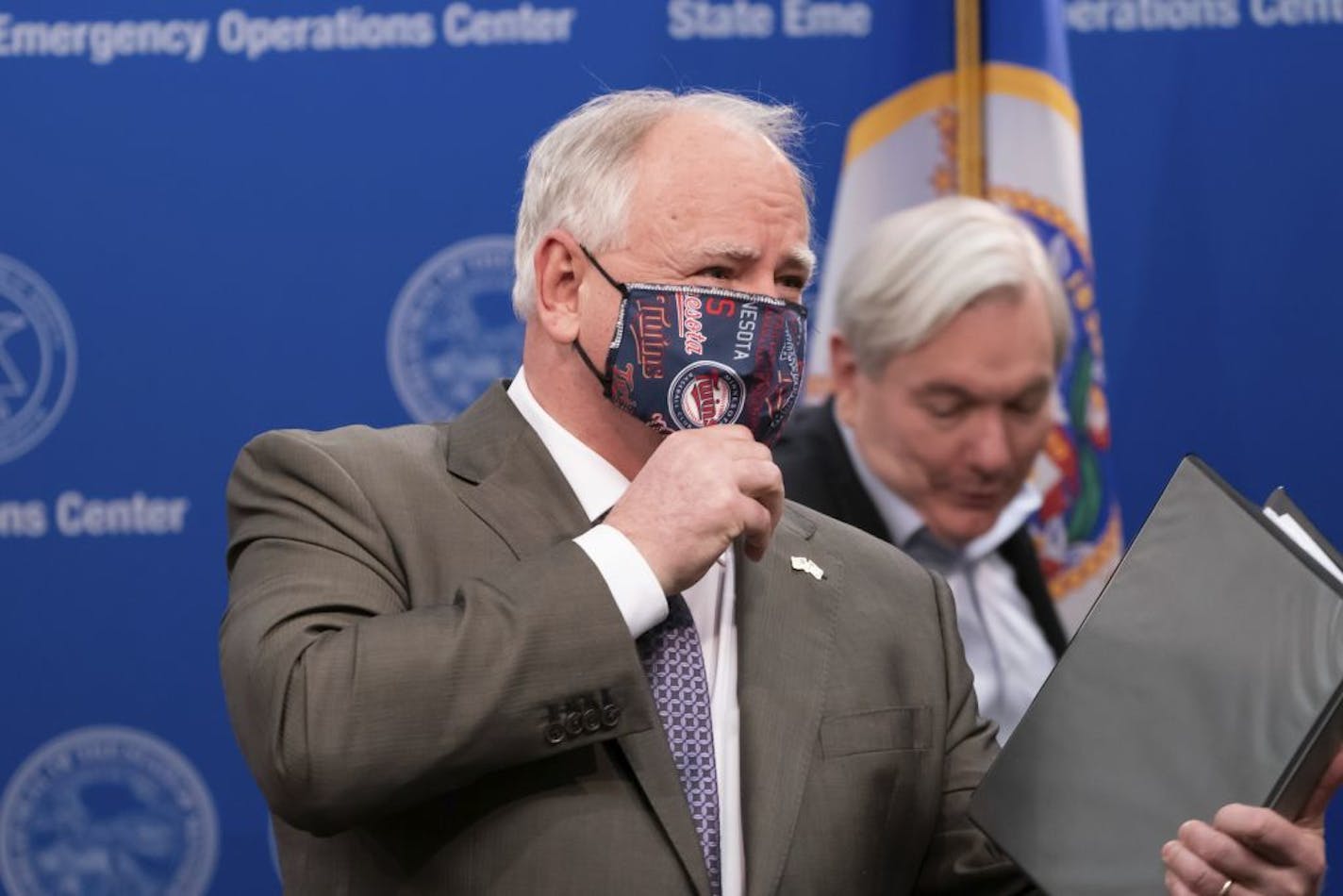 Minnesota Gov. Tim Walz put on his mask after announcing the state's plans for more coronavirus testing Wednesday in St. Paul.