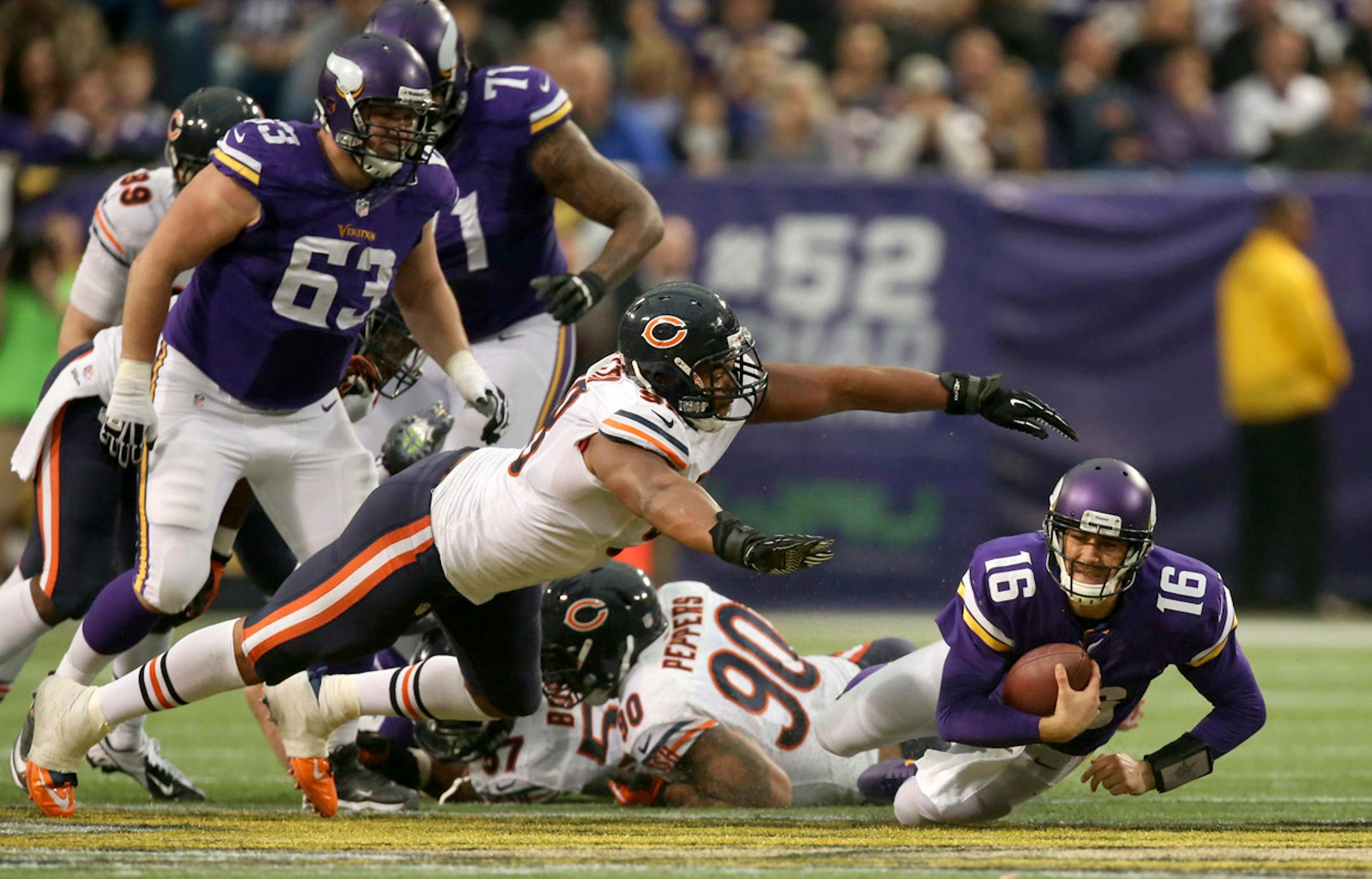 The Minnesota Vikings eeked out a 23-20 overtime win over the Chicago Bears in an NFL football game Sunday afternoon, December 1, 2013 and Mall of America Field in Minneapolis. Minnesota Vikings quarterback Matt Cassel (16) was sacked by Chicago Bears defensive tackle Corey Wootton (98) for a six yard loss in the third quarter. Chicago Bears defensive end Julius Peppers (90) also got partial credit for the sack. The Vikings had to punt on the next down. ] JEFF WHEELER ‚Ä¢ jeff.wheeler@startribun