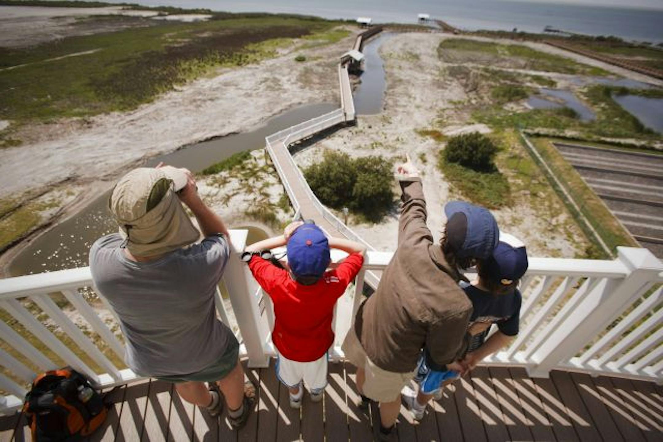A family takes in the view from the tower at the newly opened South Padre Island Birding and Nature Center in South Padre Island, Texas, March 25, 2010. The center preserves over 10,000 acres for animals via sites strung along the 120 miles of river between the town of Roma and South Padre.