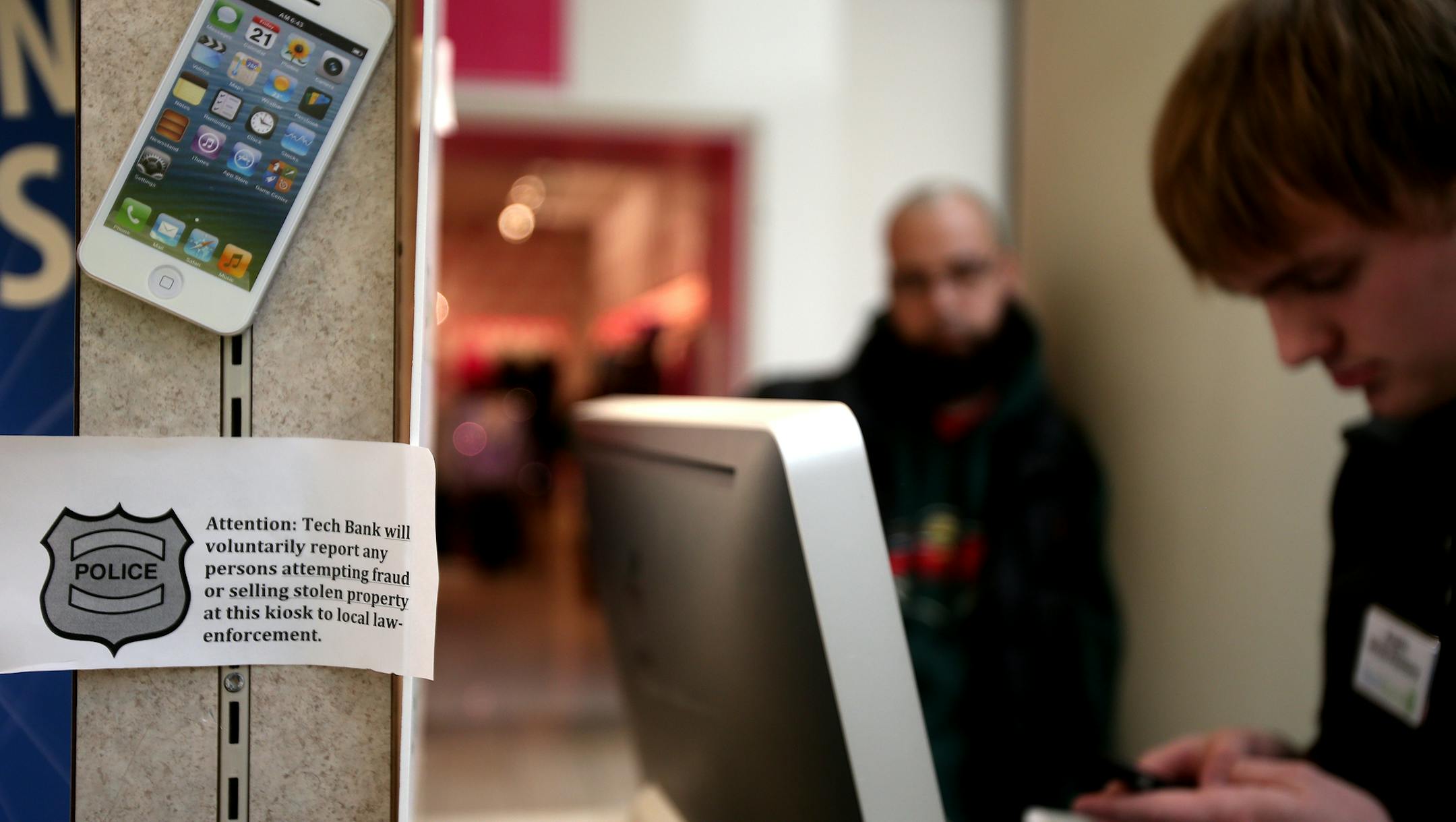 CJ Whidby of Woodbury (left), "I checked all over the internet and found that TechBank gave me the best deal for my phones." CJ Whidby (left) of Woodbury and owner of Push Muzic brought in seven phones from his business after his company changed phone service. CJ worked with Co-owner Austin White-Pentony, (right) of TechBank in Rosedale Center. Roseville, MN on December 9, 2013. ] JOELKOYAMA‚Ä¢jkoyama@startribune