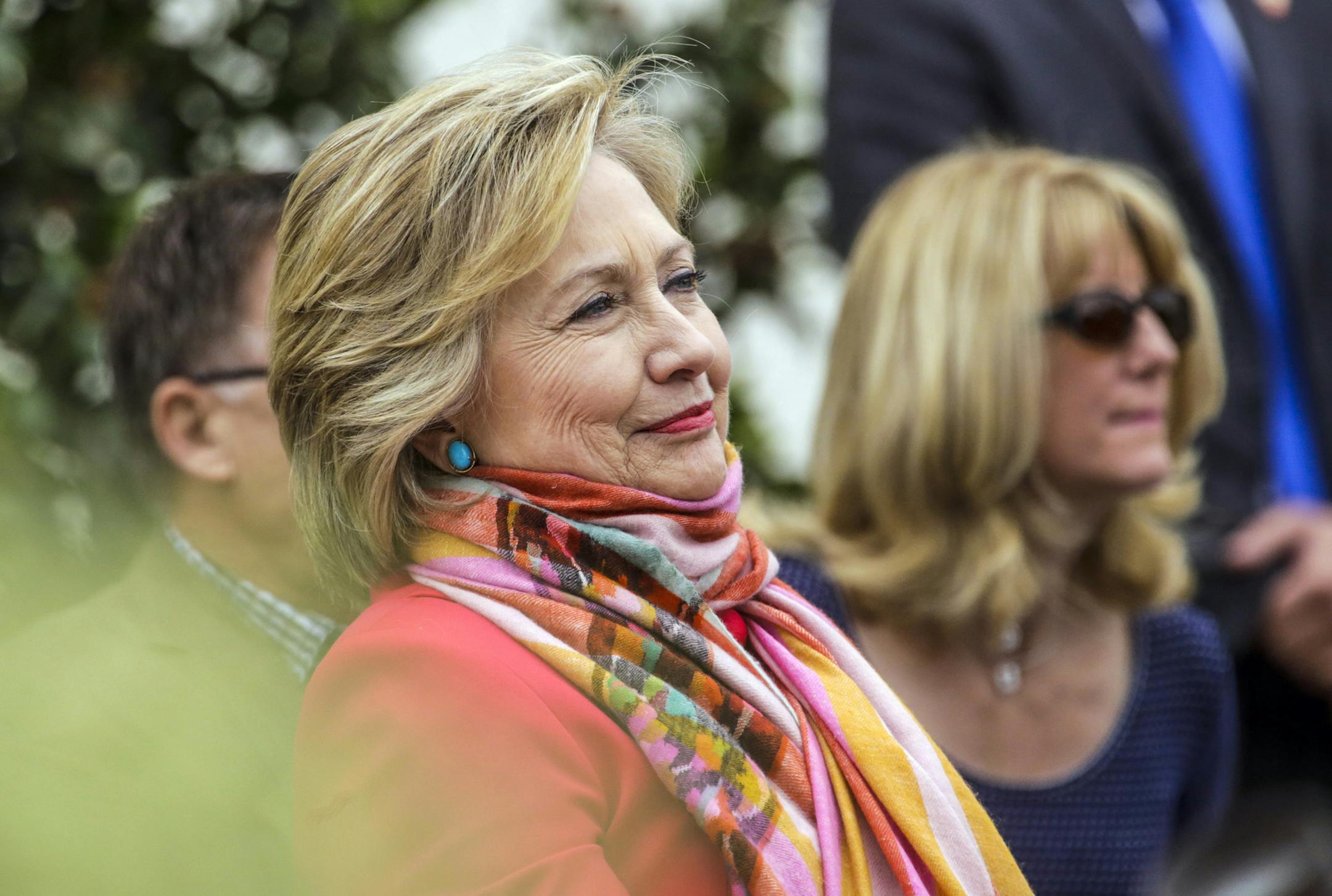 Hillary Clinton watches President Bill Clinton deliver the keynote speech at Loyola Marymount University's undergraduate commencement ceremony on Saturday, May 7, 2016, on the Los Angeles school's Westchester campus. (Irfan Khan/Los Angeles Times/TNS)