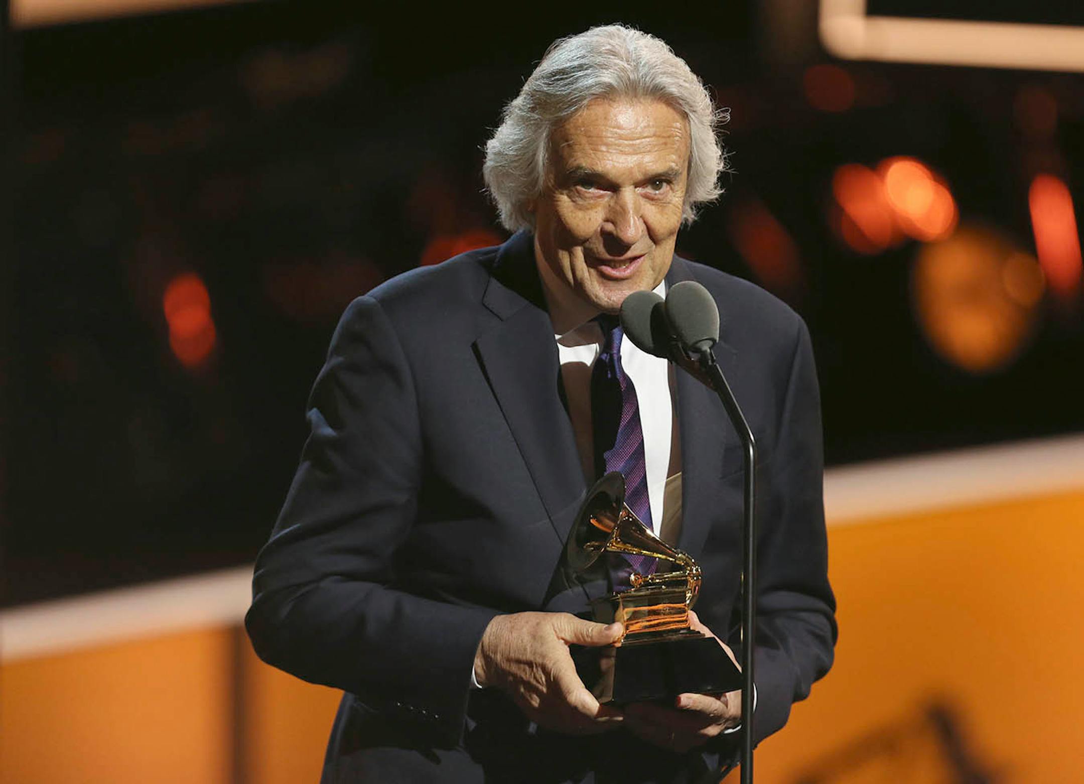 John McLaughlin accepts the best improvised jazz solo award for "Miles Beyond" at the 60th annual Grammy Awards at Madison Square Garden on Sunday, Jan. 28, 2018, in New York.