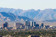 The Estrella mountain range, southwest of Phoenix, looms over the downtown skyline. A horse ride through the mountains is one of several options for f