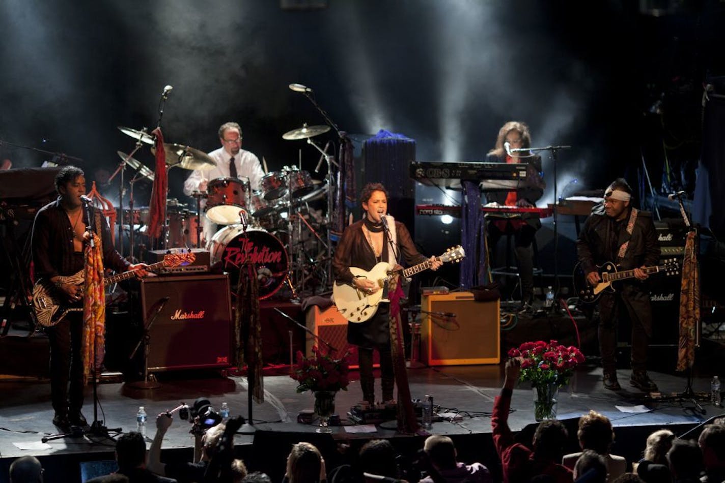 Guitarist Wendy Melvoin fronted The Revolution Reunion, a Benefit to Celebrate Life initiated by drummer Bobby Z, brought together Prince's former backing band together in a benefit for the American Heart Association at First Ave. in Minneapolis, Minn., Sunday night, February 19, 2012. At left was bassist Brown Mark while guitarist Dez Dickerson is at right. The keyboardist is Lisa Coleman.