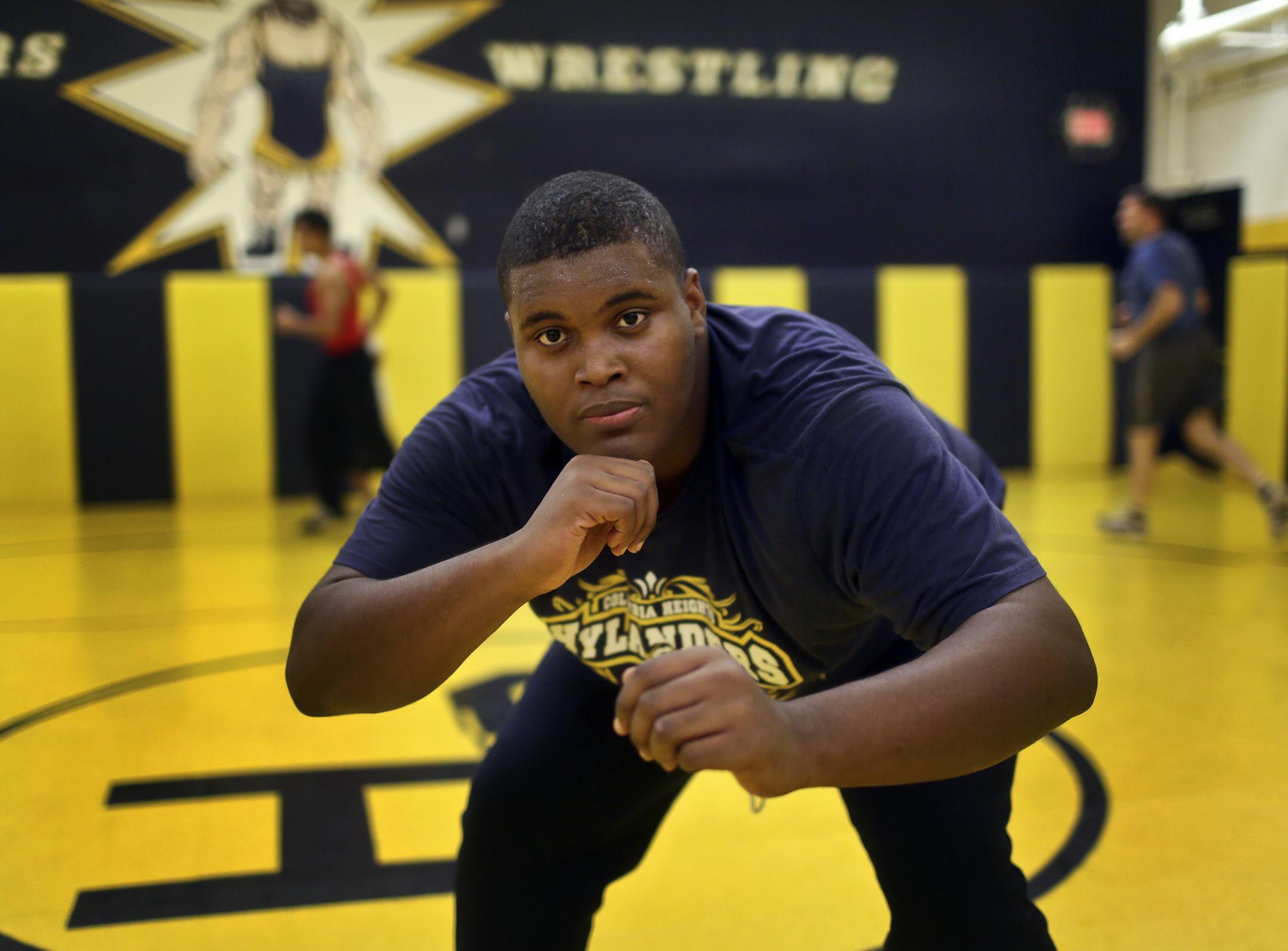 Heavy weight wrestler Brady Netland has shed more than 60 pounds since last year and gotten his weight under the 285 pound wrestling maximum and will challenge for a varsity spot. Here, Netland was seen at practice Wednesday, Nov. 20, 2013, at Columbia Heights High School in Columbia Heights, MN.](DAVID JOLES/STARTRIBUNE) djoles@startribune.com Two years ago, big Brady Netland weighed 305 pounds. Last year for football at Columbia Heights High, Netland started the season at 345 pounds. When his