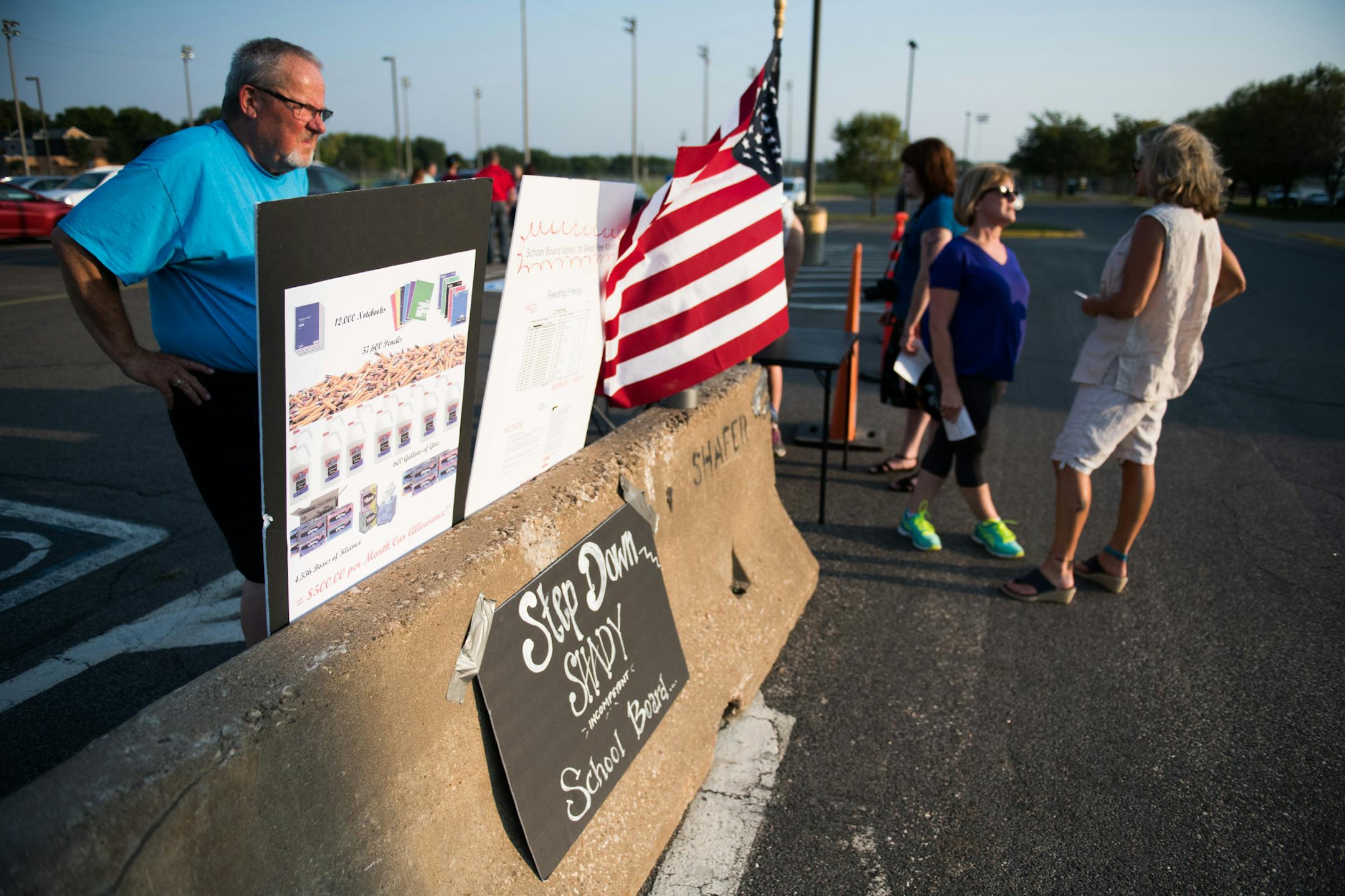 Curt Olson erected poster boards in the parking lot outside the school. ] MARK VANCLEAVE ï mark.vancleave@startribune.com * Members of FACT: Friends & Concerned TaxPayers of Shakopee gathered outside a Shakopee Schools meeting at Shakopee West Junior High on Thursday, Sept. 14, 2017. They believe school board members were negligent or complicit in overspending by former superintendent Rod Thompson.